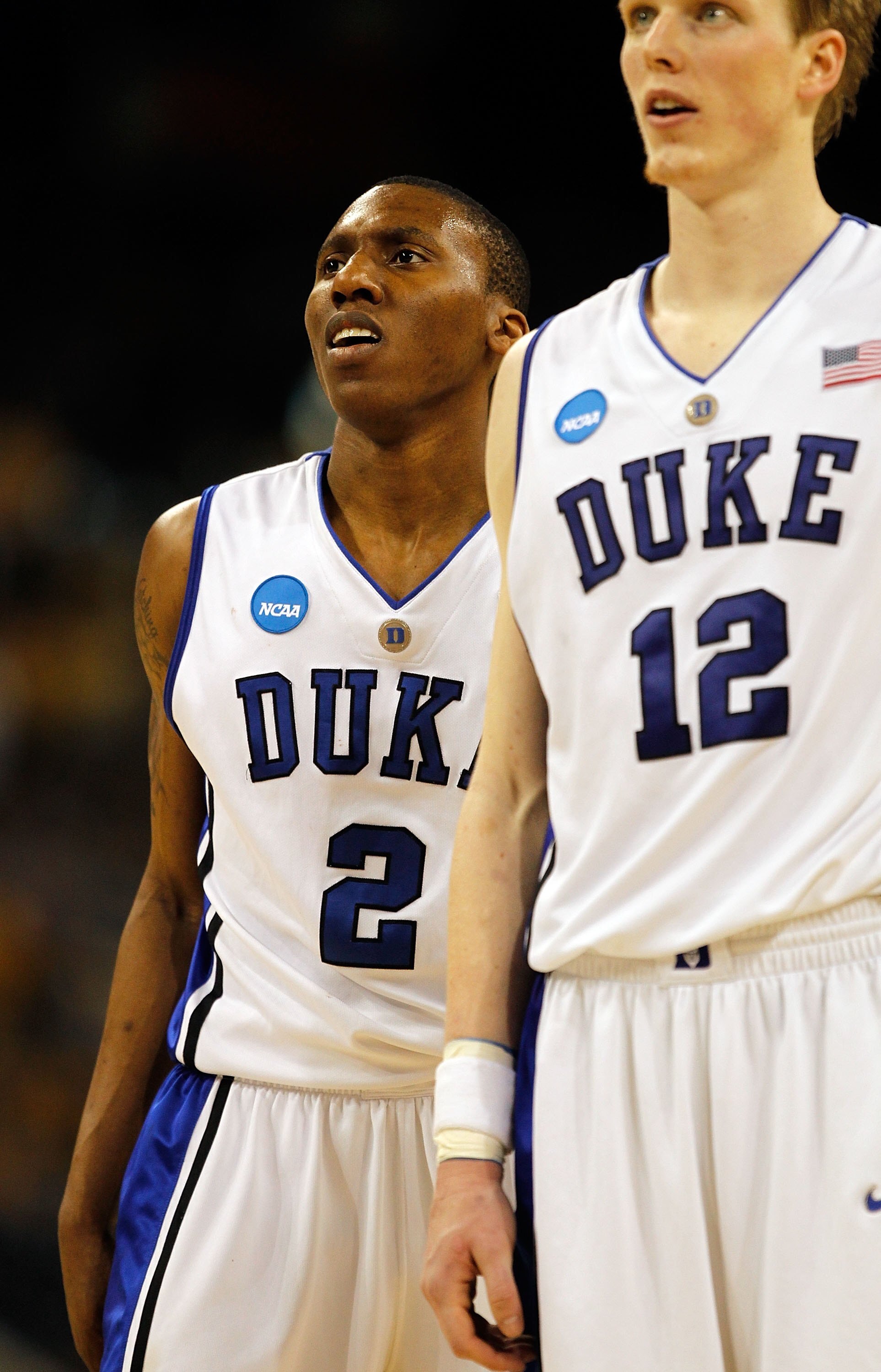 HOUSTON - MARCH 28: Nolan Smith #2 and Kyle Singler #12 of the Duke Blue Devils wait as a teammate shoots free-throws against the Baylor Bears during the south regional final of the 2010 NCAA men's basketball tournament at Reliant Stadium on March 28, 201