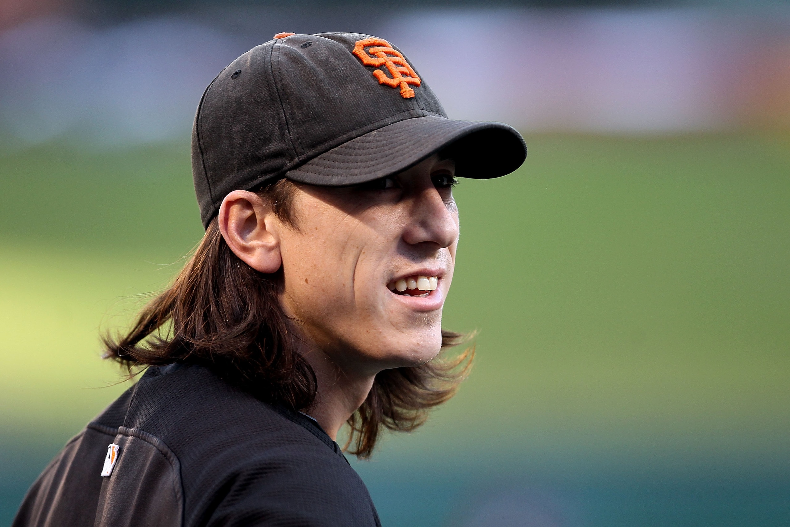 ARLINGTON, TX - OCTOBER 31:  Tim Lincecum #55 of the San Francisco Giants looks on during batting practice against the Texas Rangers in Game Four of the 2010 MLB World Series at Rangers Ballpark in Arlington on October 31, 2010 in Arlington, Texas.  (Phot