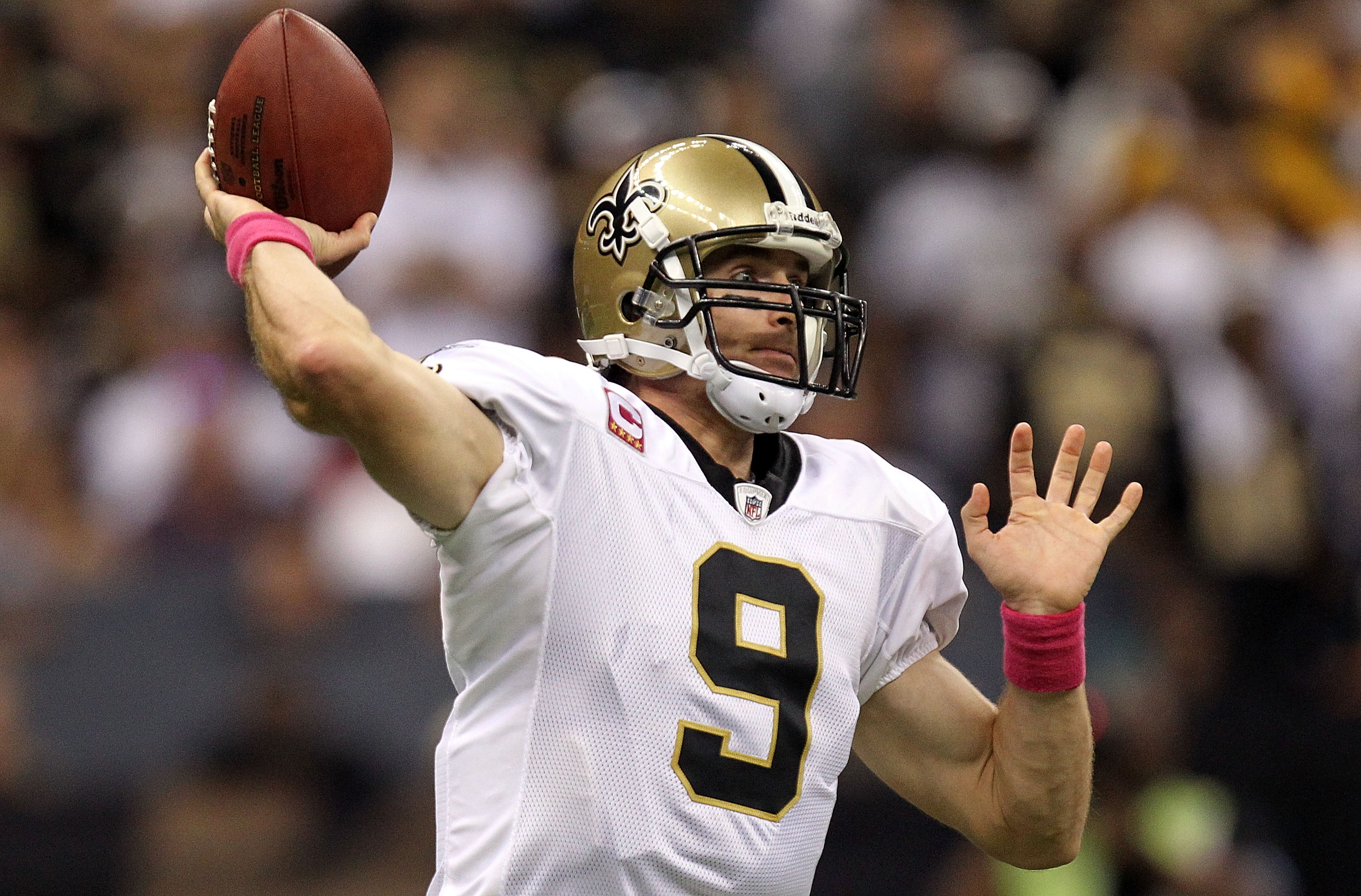 NEW ORLEANS - OCTOBER 03:  Quarterback Drew Brees #9 of the New Orleans Saints passes against the Carolina Panthers at the Louisiana Superdome on October 3, 2010 in New Orleans, Louisiana.  (Photo by Ronald Martinez/Getty Images)