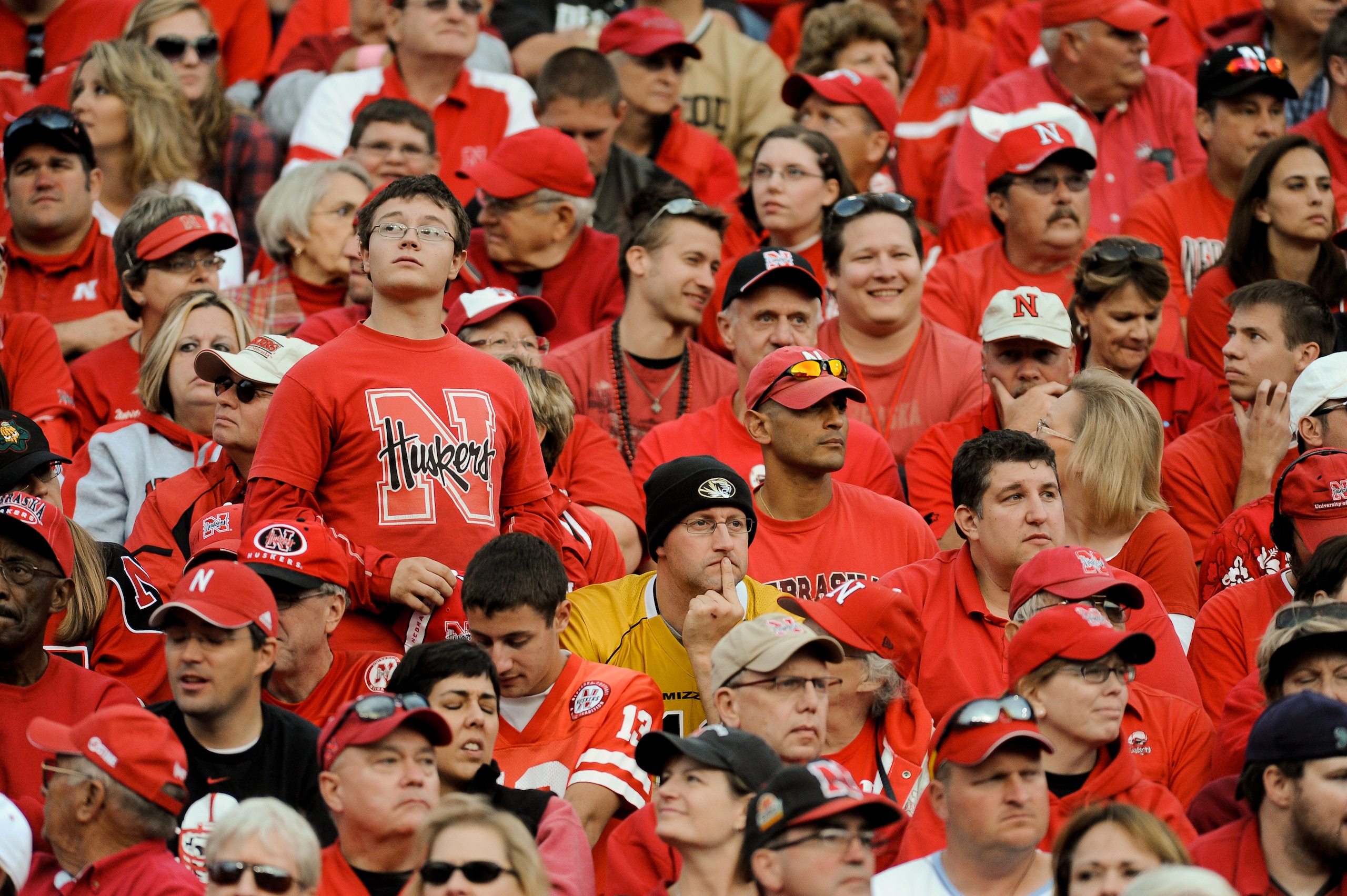 LINCOLN, NE - OCTOBER 30: Fans of the Missouri Tigers sit quietly in a sea of red during second half action of their game at Memorial Stadium on October 30, 2010 in Lincoln, Nebraska. Nebraska Defeated Missouri 31-17. (Photo by Eric Francis/Getty Images) LINCOLN, NE - OCTOBER 30: Fans of the Missouri Tigers sit quietly in a sea of red during second half action of their game at Memorial Stadium on October 30, 2010 in Lincoln, Nebraska. Nebraska Defeated Missouri 31-17. (Photo by Eric Francis/Getty Images)