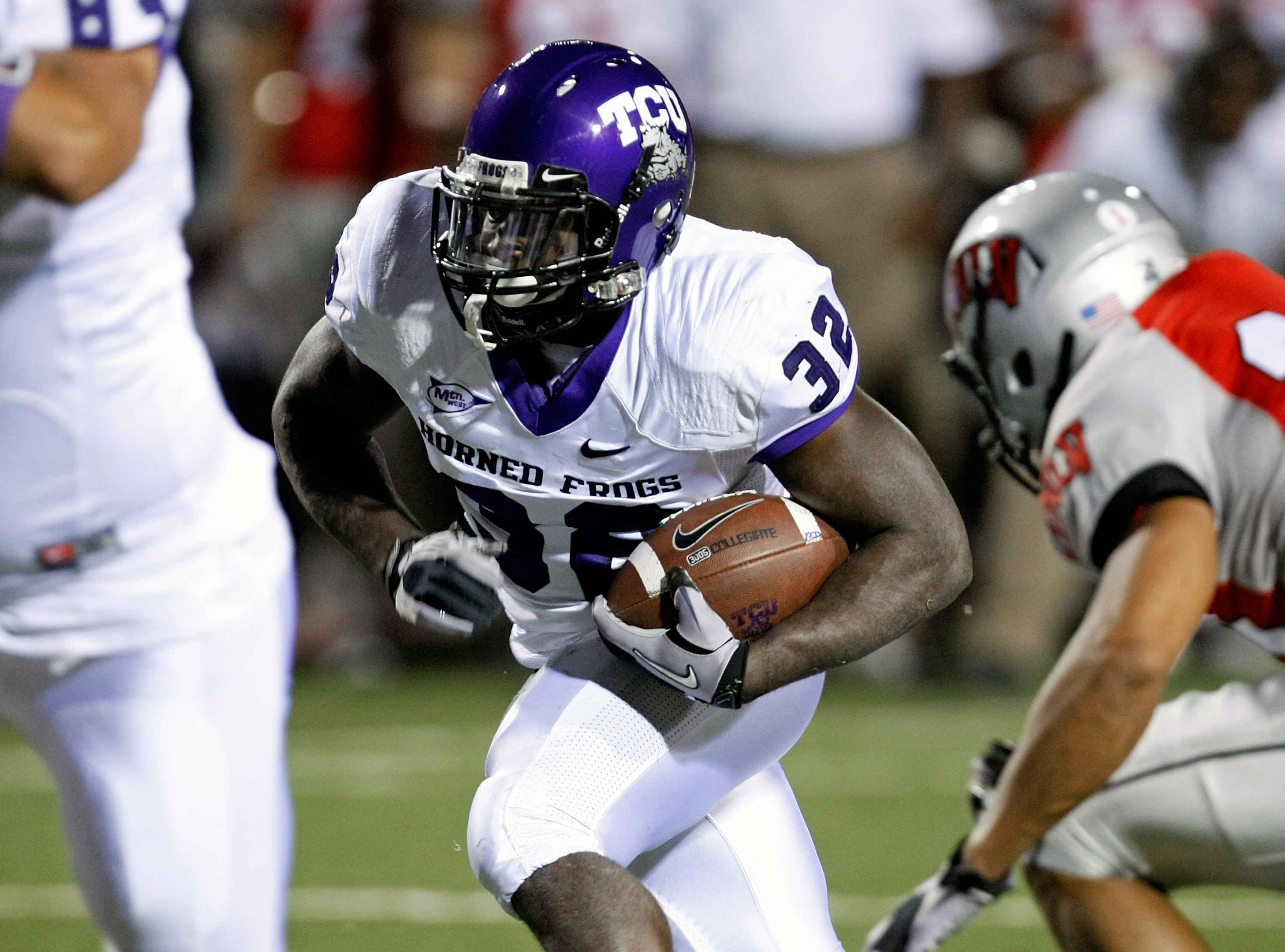 LAS VEGAS - OCTOBER 30:  Waymon James #32 of the Texas Christian University Horned Frogs runs for yardage against the UNLV Rebels at Sam Boyd Stadium October 30, 2010 in Las Vegas, Nevada. TCU won 48-6.  (Photo by Ethan Miller/Getty Images)