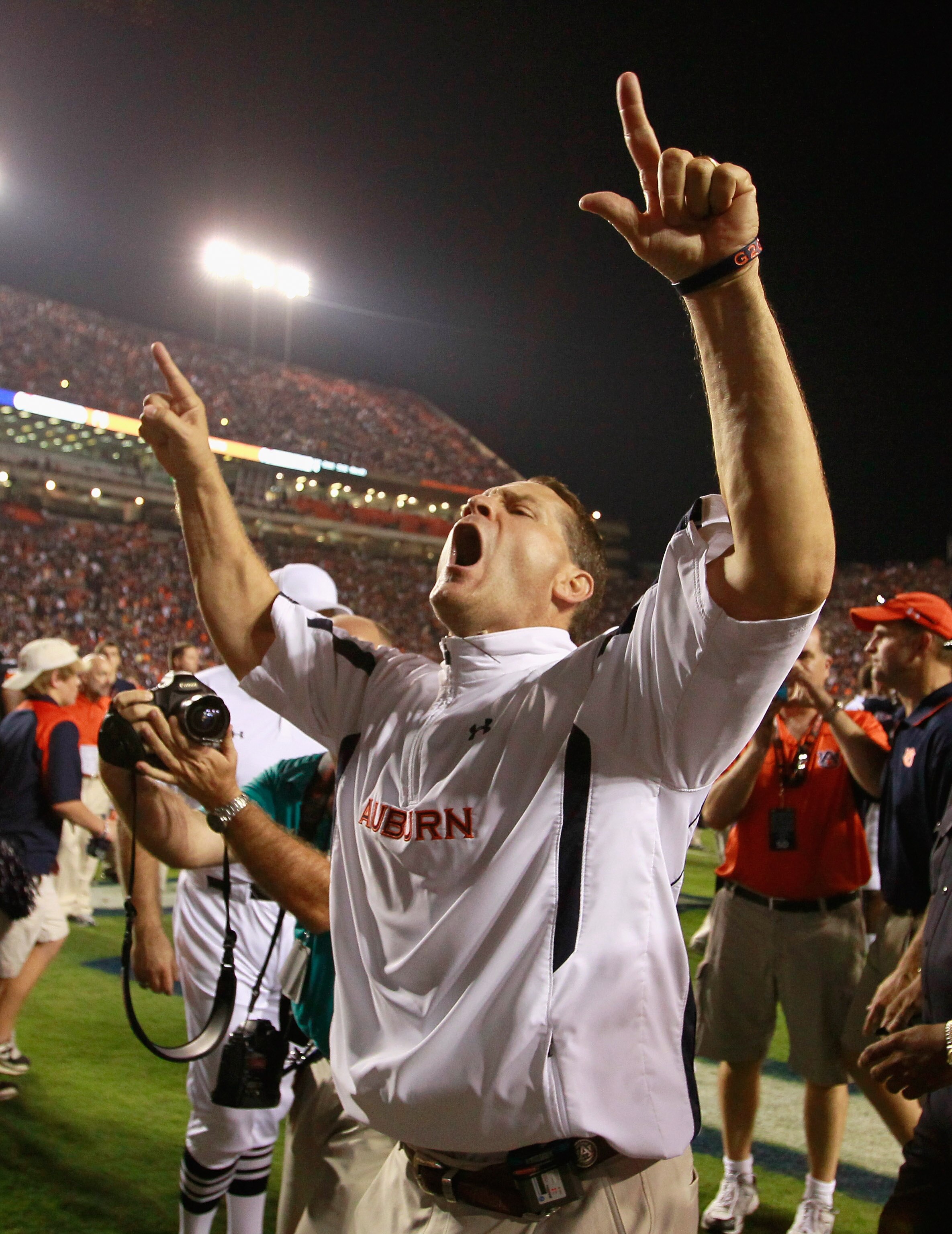 AUBURN, AL - SEPTEMBER 18:  Head coach Gene Chizik of the Auburn Tigers celebrates after their 27-24 overtime win over the Clemson Tigers at Jordan-Hare Stadium on September 18, 2010 in Auburn, Alabama.  (Photo by Kevin C. Cox/Getty Images)