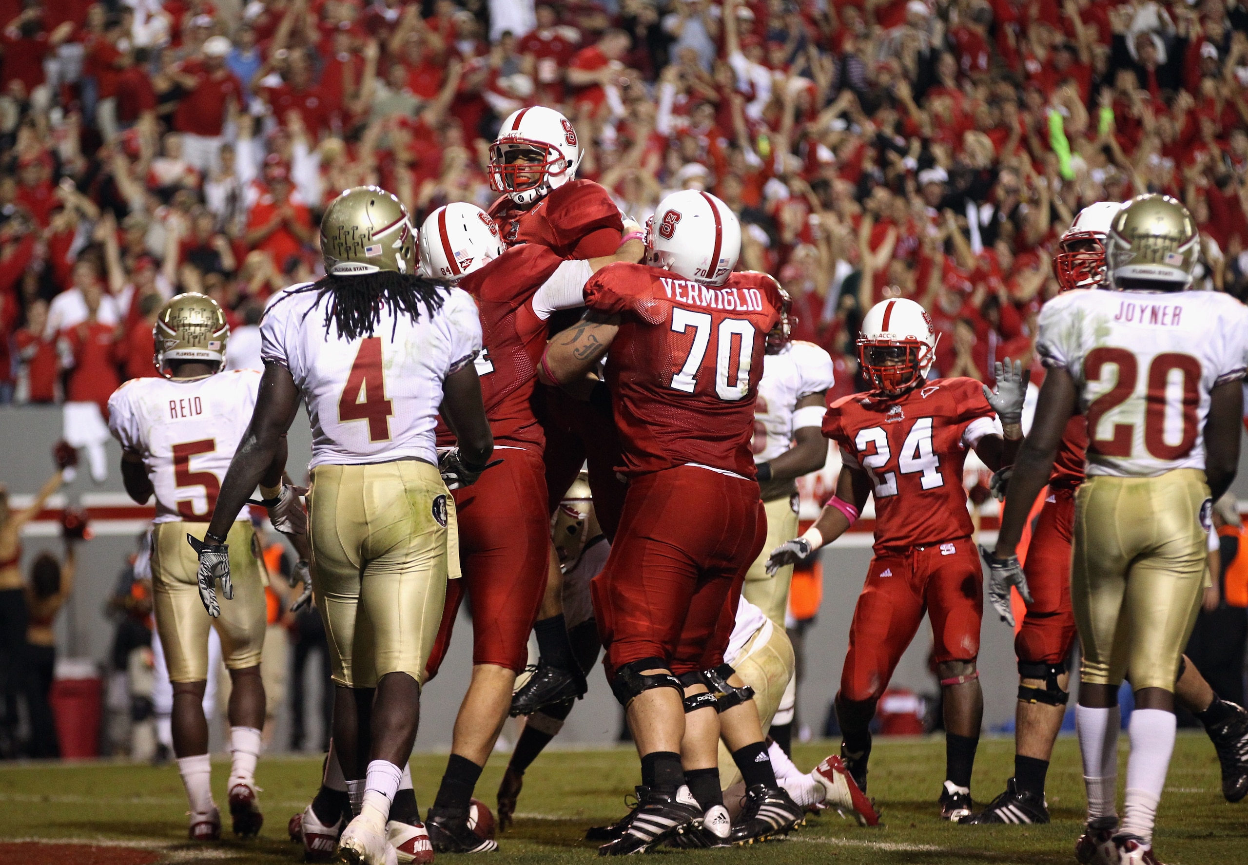 RALEIGH, NC - OCTOBER 28:  Russell Wilson #16 of the North Carolina State Wolfpack celebrates after scoring a touchdown against the Florida State Seminoles during their game at Carter-Finley Stadium on October 28, 2010 in Raleigh, North Carolina.  (Photo