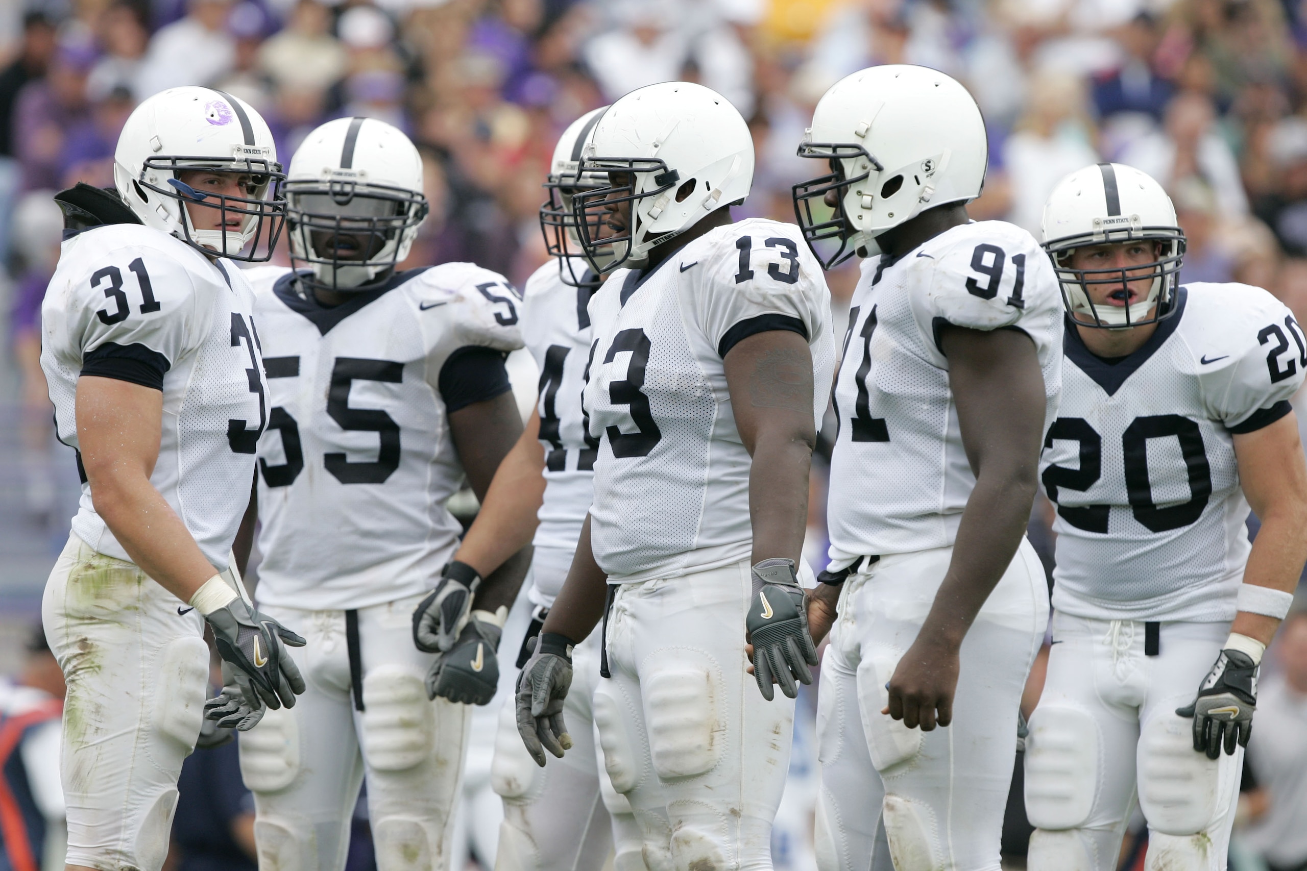 EVANSTON, IL - SEPTEMBER 24:  Linebacker Paul Posluszny #31 of the Penn State Nittany Lions looks to the sidelines for a play call as he hudles up the defense against the Northwestern Wildcats on September 24, 2005 at Ryan Field in Evanston, Illinois. Pen