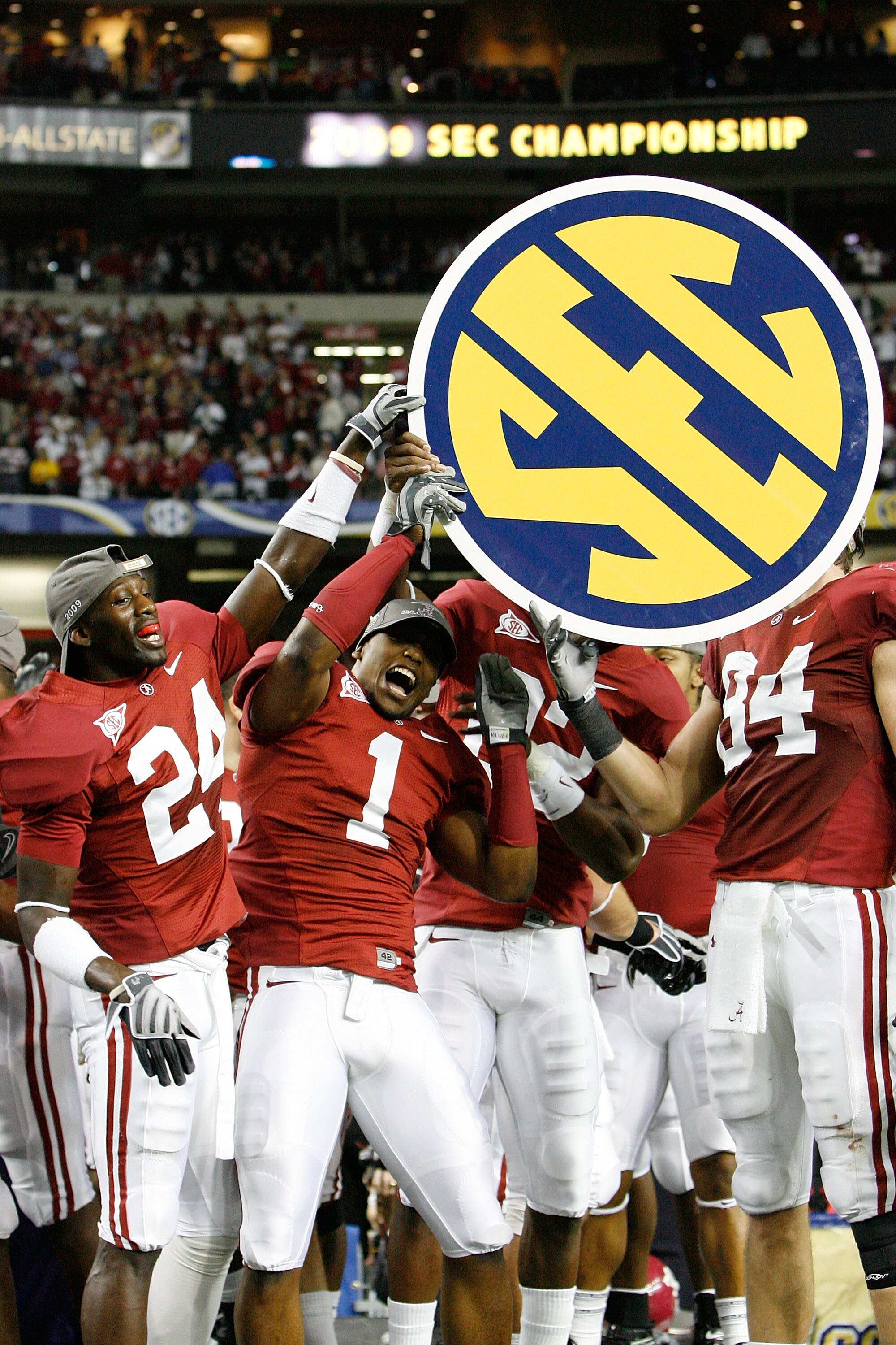 ATLANTA - DECEMBER 05:  Members of the Alabama Crimson Tide celebrate after defeating the Florida Gators 31-13 during the SEC Championship at the Georgia Dome on December 5, 2009 in Atlanta, Georgia.  (Photo by Chris Graythen/Getty Images)