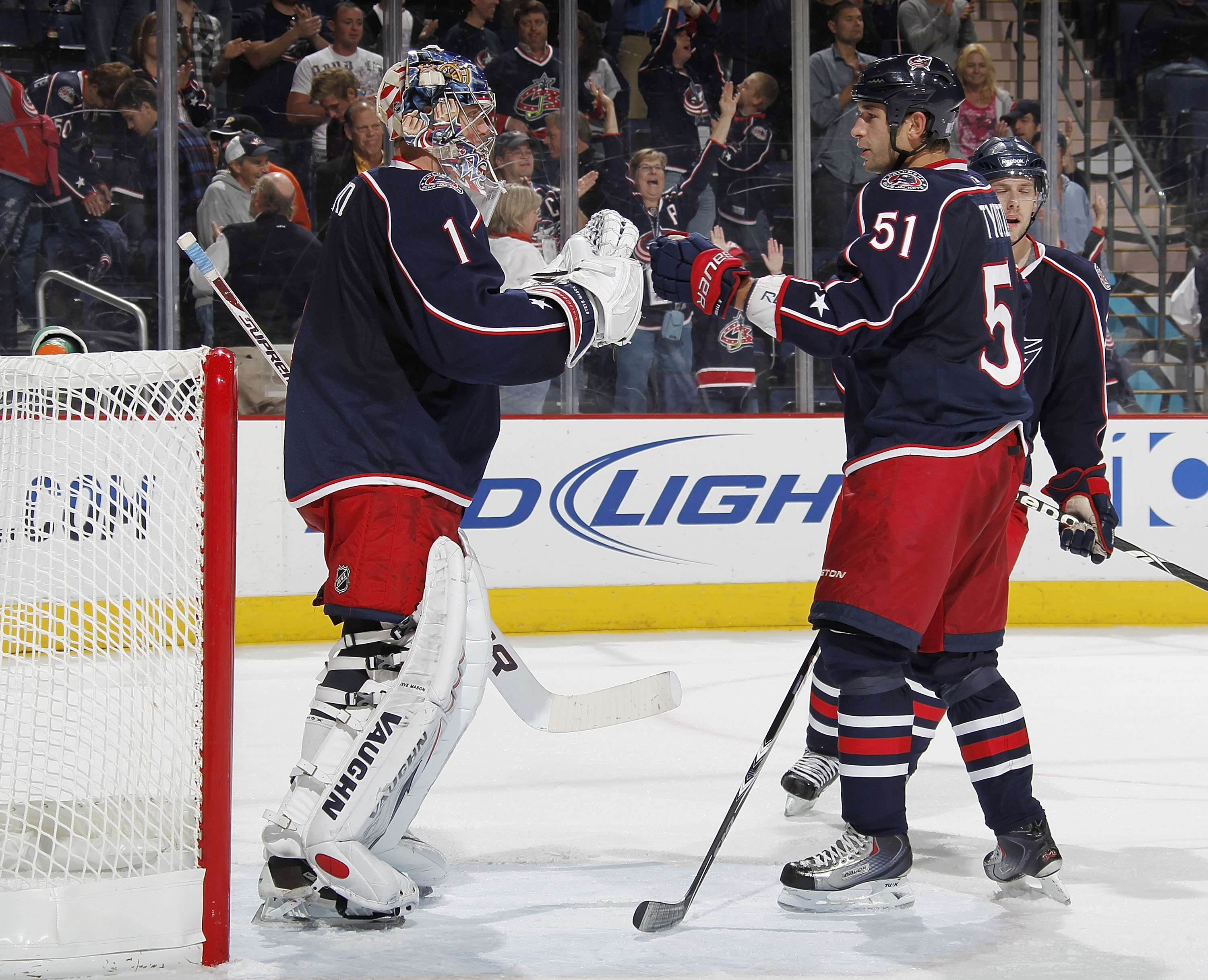 COLUMBUS, OH - OCTOBER 20:  Steve Mason #1 of the Columbus Blue Jackets is congratulated by Fedor Tyutin #51 after beating the Anaheim Ducks 3-1 on October 20, 2010 at Nationwide Arena in Columbus, Ohio.  (Photo by Gregory Shamus/Getty Images)