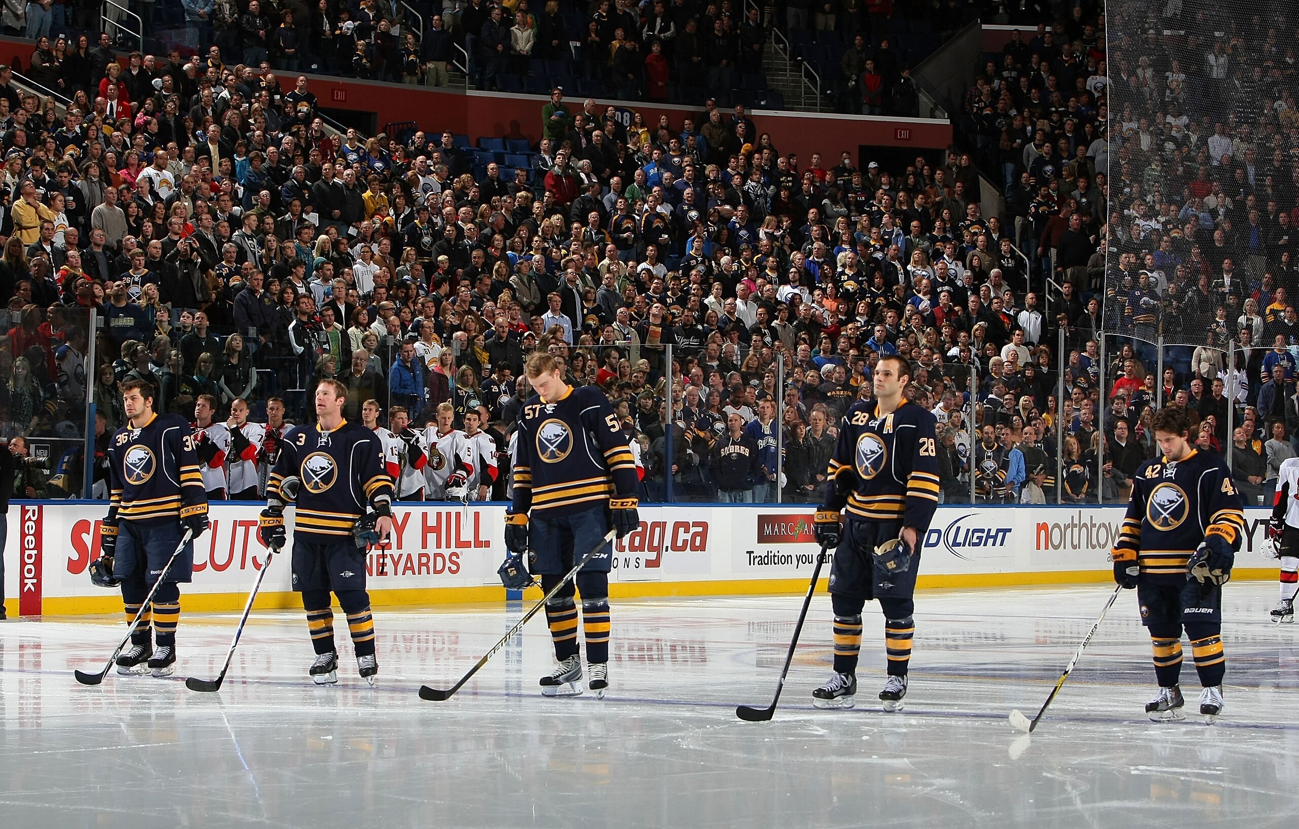 BUFFALO - OCTOBER 22:  (L to R) Patrick Kaleta #36,Jordan Leopold #3,Tyler Myers #57,Paul Gaustad #28 and Nathan Gerbe #42 stand for the national anthems in preperation for facing the Ottawa Senators during their NHL game at HSBC Arena October 22, 2010 in