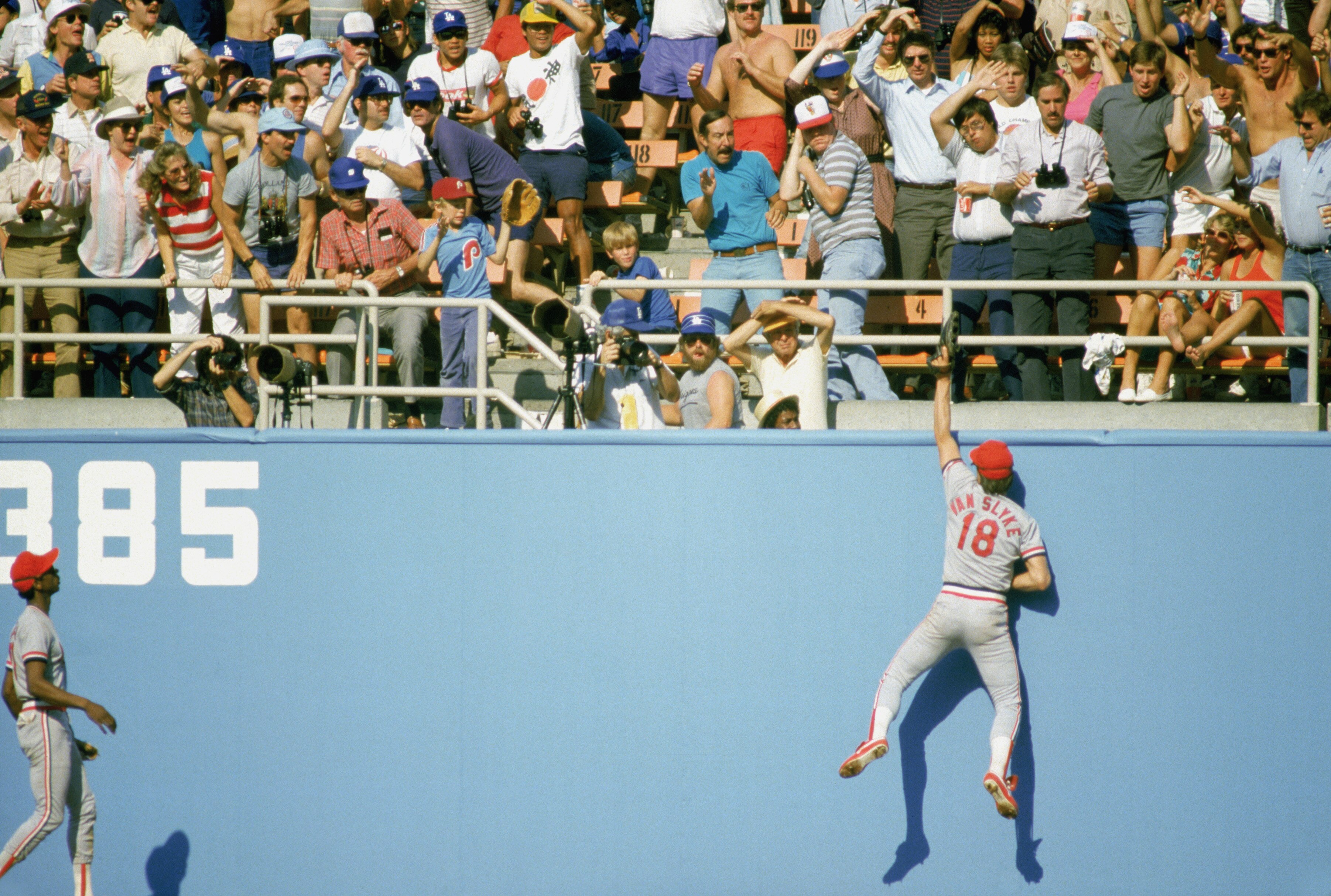 LOS ANGELES - OCTOBER 16: Andy Van Slyke #18 of the St. Louis Cardinals reaches for the catch against the Los Angeles Dodgers during Game 6 of the National League Championship Series on October 16, 1985 at Dodger Stadium in Los Angeles, California. (Photo