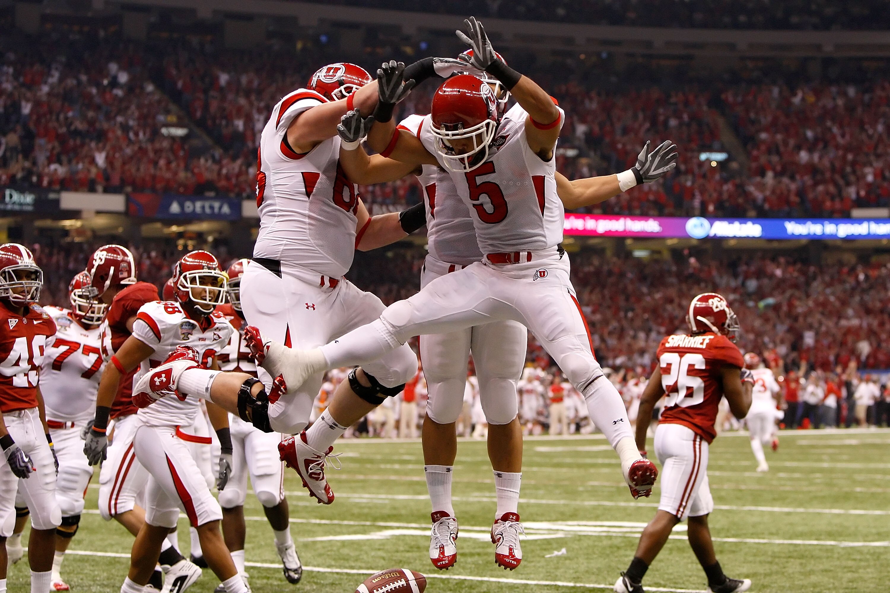 NEW ORLEANS - JANUARY 02:  Wide receiver Brent Casteel #5 of the Utah Utes reacts with teammate Zane Beadles after Casteel scores a six-yard touchdwon against the Alabama Crimson Tide during the first quarter of the 75th Allstate Sugar Bowl at the Louisia
