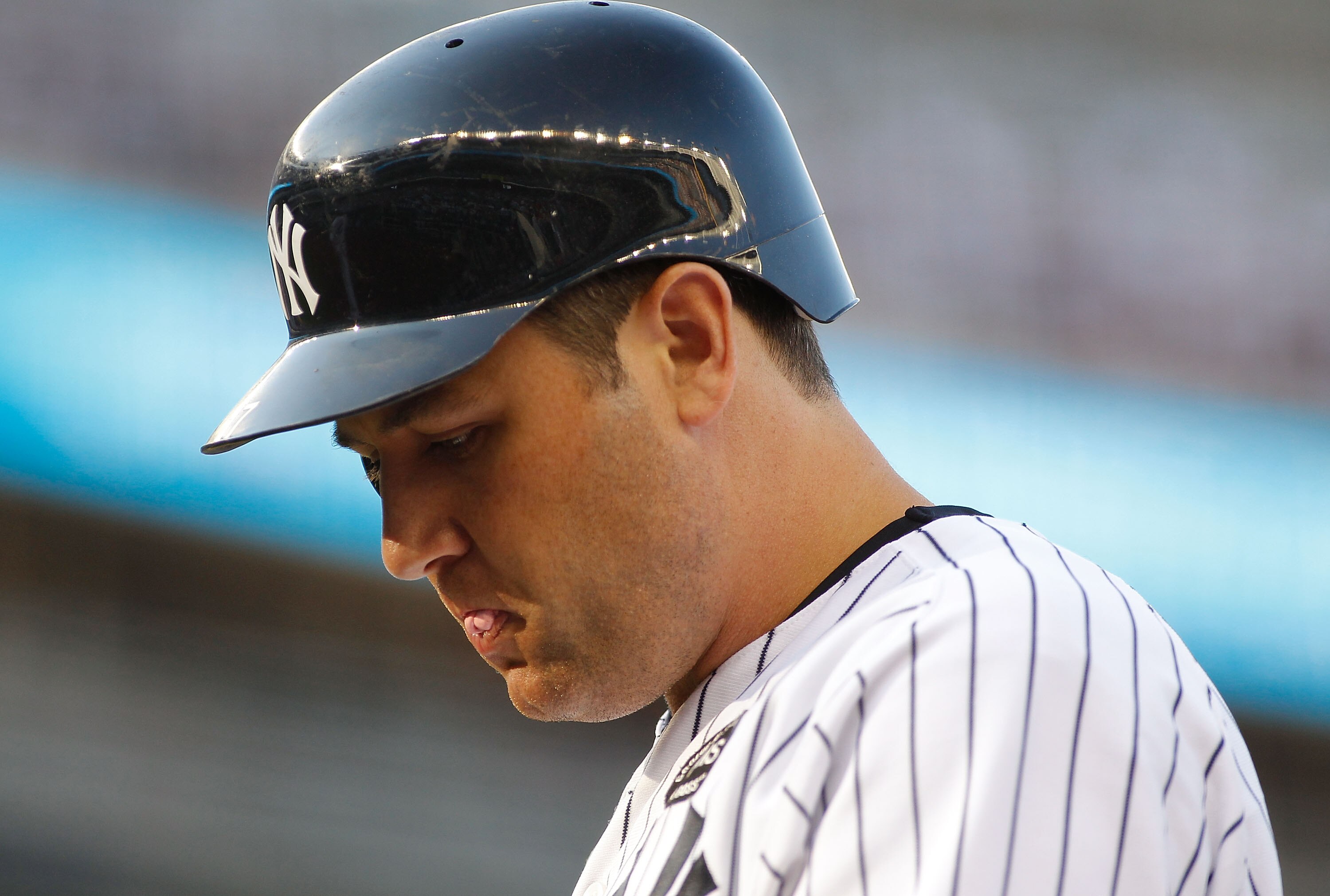 NEW YORK - AUGUST 07:  Lance Berkman #17 of the New York Yankees walks back to the bench after making the third out with runners on first and third against the Boston Red Sox on August 7, 2010 at Yankee Stadium in the Bronx borough of New York City.  (Pho