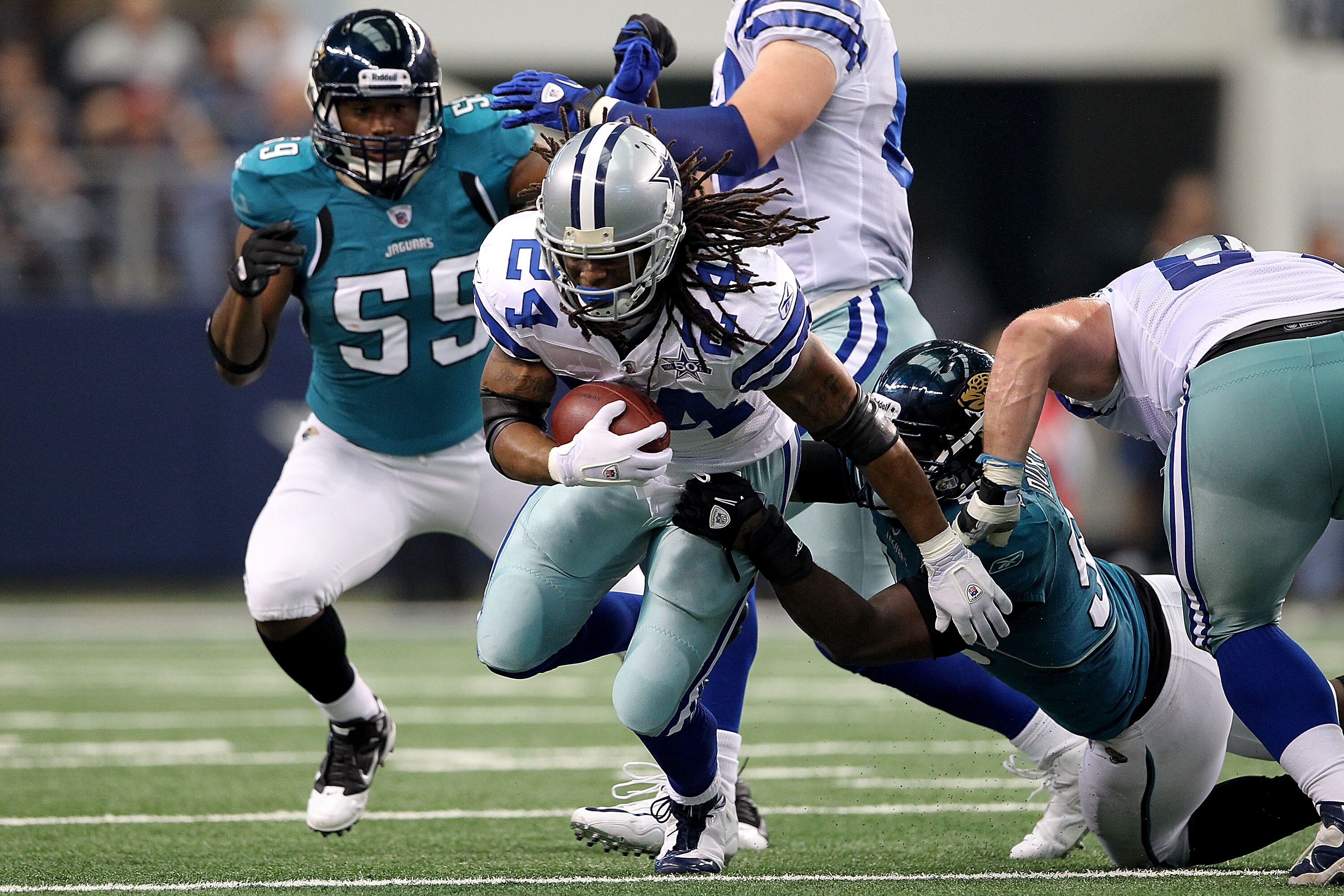 ARLINGTON, TX - OCTOBER 31:  Marion Barber #24 of the Dallas Cowboys runs the ball against the Jacksonville Jaguars at Cowboys Stadium on October 31, 2010 in Arlington, Texas.  (Photo by Chris Chambers/Getty Images)