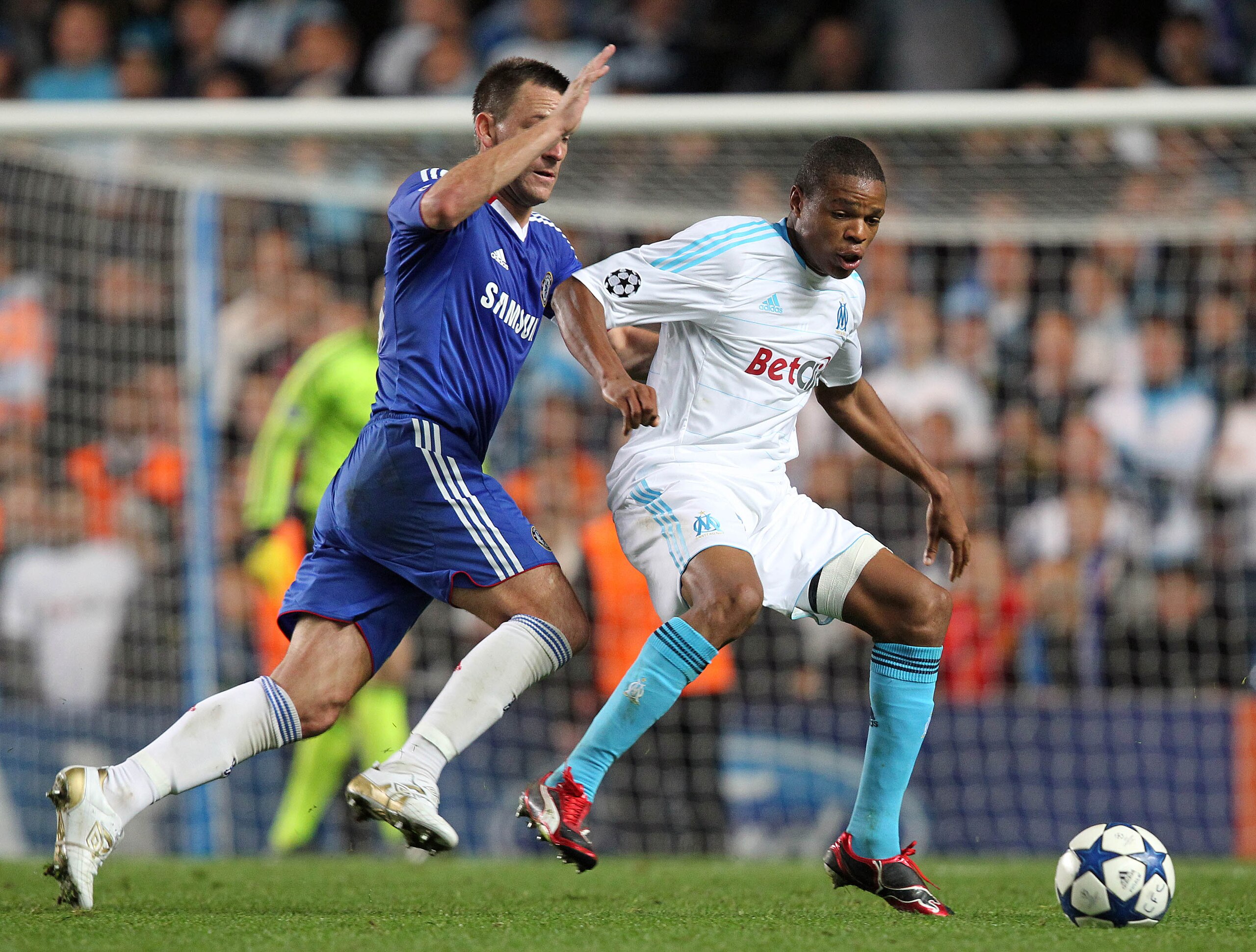 LONDON, ENGLAND - SEPTEMBER 28 :   Loic Remy of Marseille shields the ball from John Terry, Captain of Chelsea during the UEFA Champions League Group F match between Chelsea and Marseille at Stamford Bridge on September 28, 2010 in London, England.  (Phot