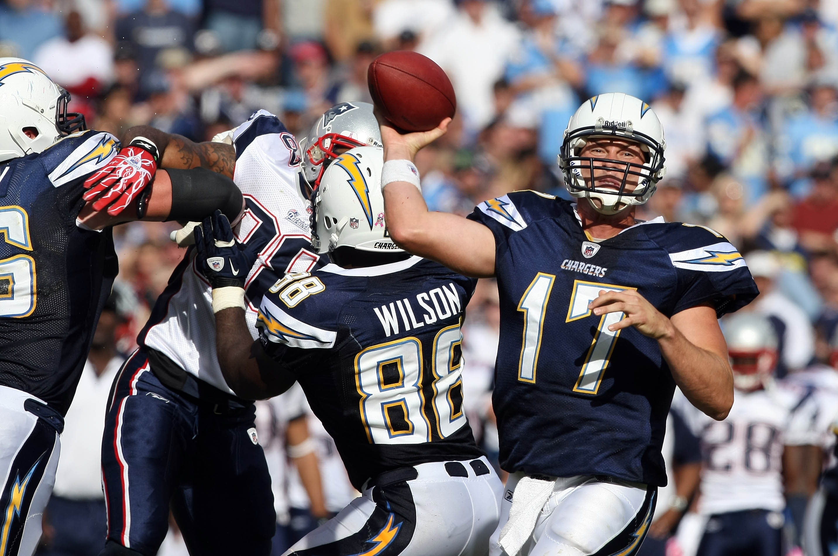 SAN DIEGO - OCTOBER 24:  Quarterback Philip Rivers #17 of the San Diego Chargers throws the ball against the pressure of the New England Patriots defense during NFL game on October 24, 2010 at Qualcomm Stadium in San Diego, California. (Photo by Donald Mi