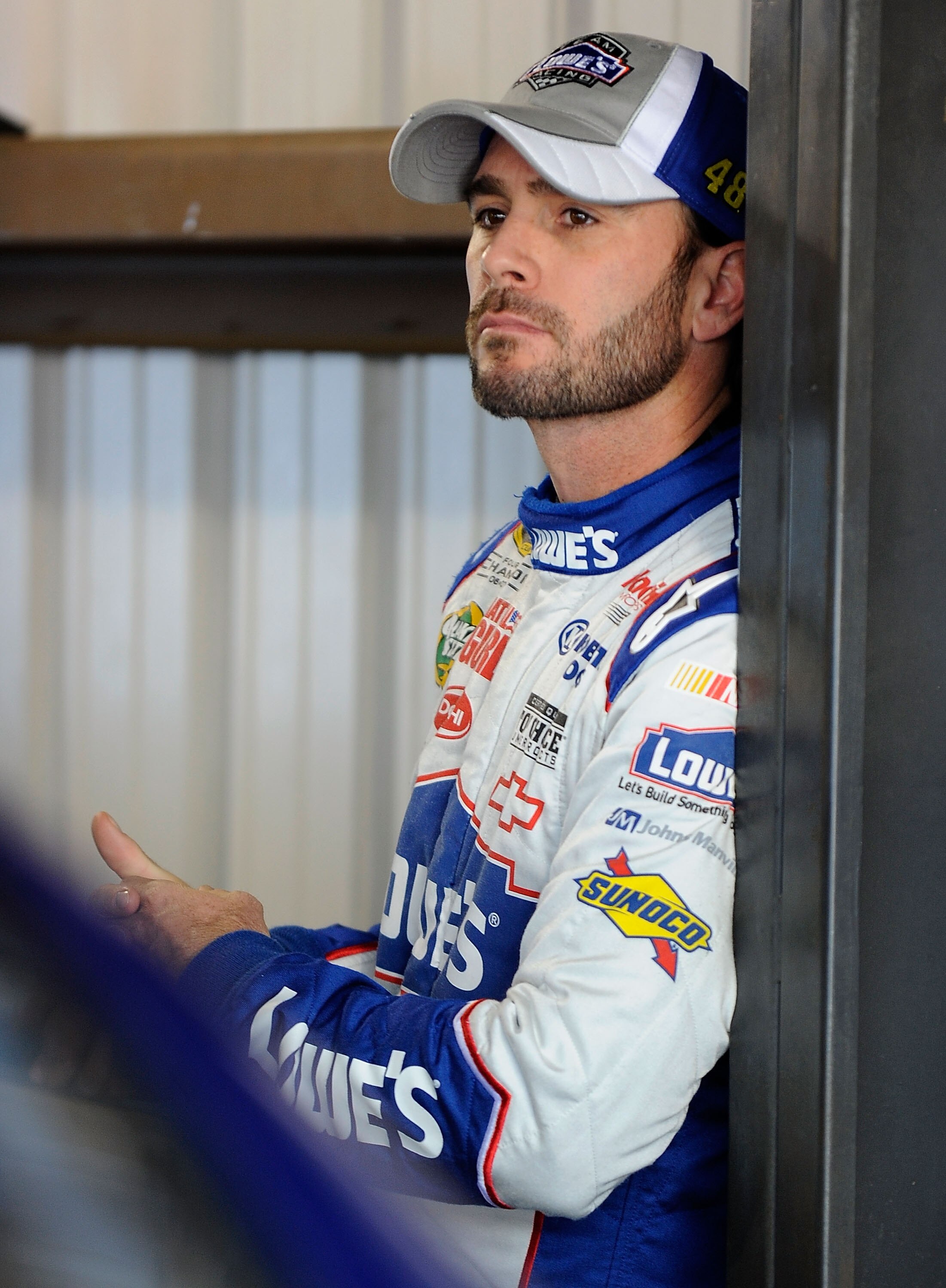 MARTINSVILLE, VA - OCTOBER 22:  Jimmie Johnson, driver of the #48 Lowe's Chevrolet, stands in the garage prior to practice for the NASCAR Sprint Cup Series TUMS Fast Relief 500 at Martinsville Speedway on October 22, 2010 in Martinsville, Virginia.  (Phot