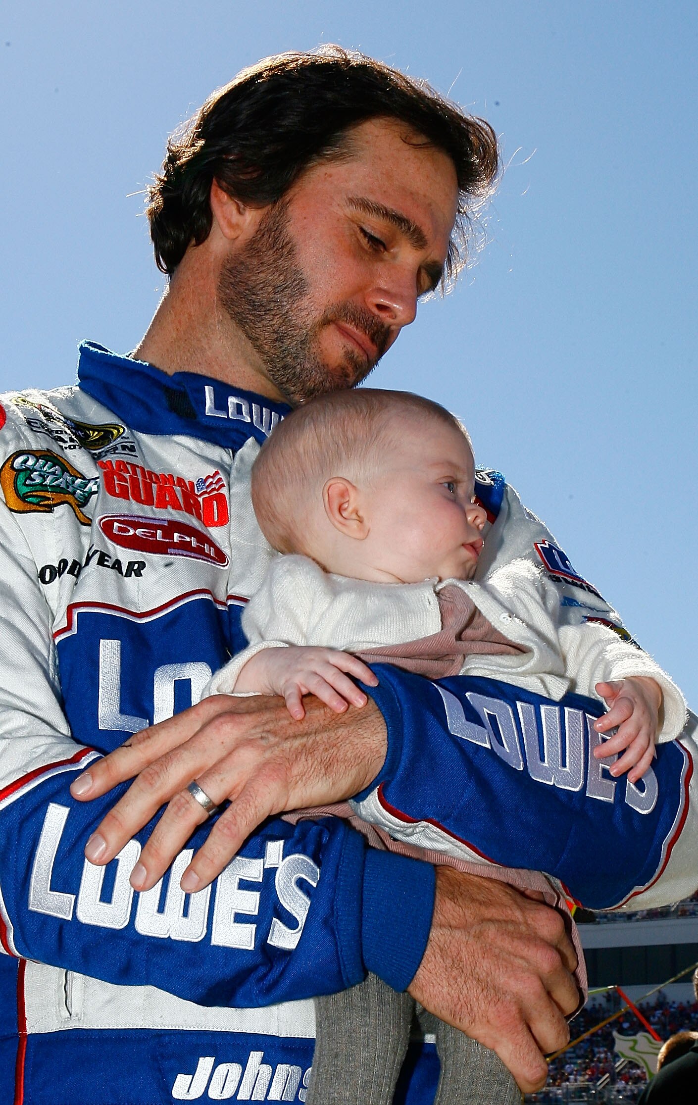 MARTINSVILLE, VA - OCTOBER 24:  Jimmie Johnson, driver of the #48 Lowe's Chevrolet, hold his daughter Genevieve Marie on the grid prior to the NASCAR Sprint Cup Series TUMS Fast Relief 500 at Martinsville Speedway on October 24, 2010 in Martinsville, Virg