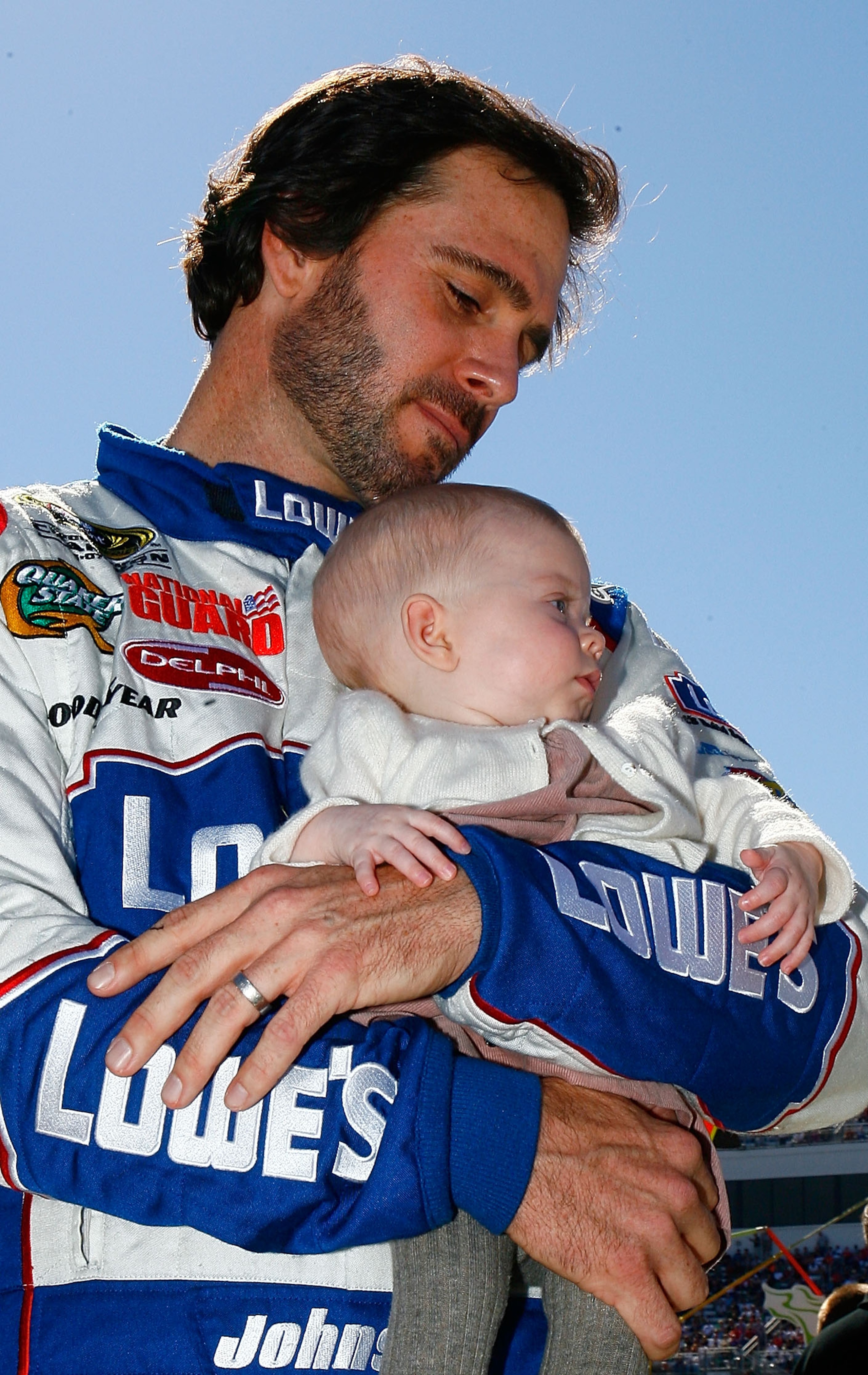 MARTINSVILLE, VA - OCTOBER 24:  Jimmie Johnson, driver of the #48 Lowe's Chevrolet, hold his daughter Genevieve Marie on the grid prior to the NASCAR Sprint Cup Series TUMS Fast Relief 500 at Martinsville Speedway on October 24, 2010 in Martinsville, Virg