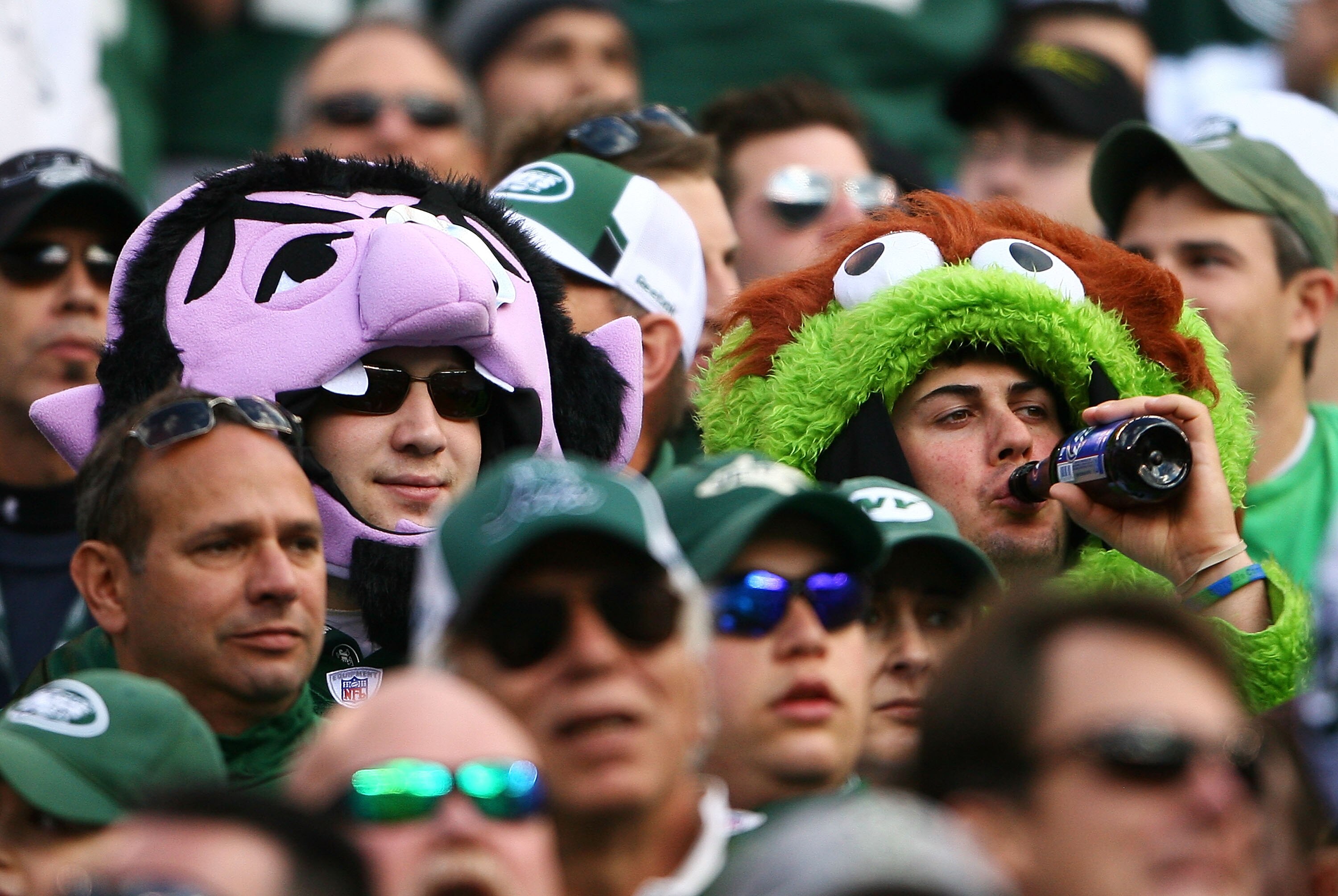 EAST RUTHERFORD, NJ - OCTOBER 31: Fans of the New York Jets dressed up as 'Oscar the Grouch' and 'The Count,' characters from the television show 'Sesame Street,' for the Jets game against the Green Bay Packers on October 31, 2010 at the New Meadowlands S