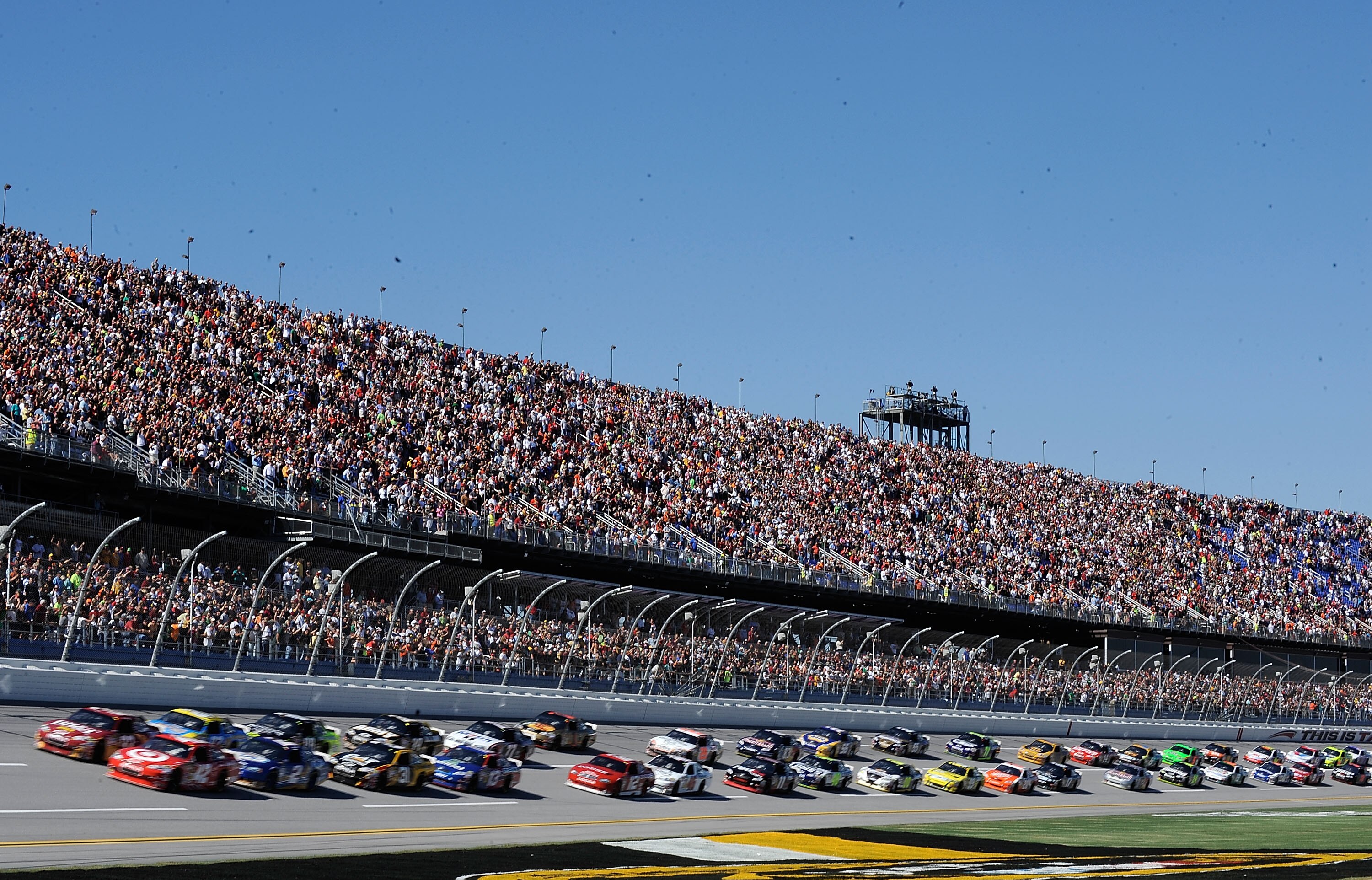 TALLADEGA, AL - OCTOBER 31:  Juan Pablo Montoya, driver of the #42 Target Chevrolet, and Clint Bowyer, driver of the #33 BB&T Chevrolet, lead the field to the green flag to start the NASCAR Sprint Cup Series AMP Energy Juice 500 at Talladega Superspeedway