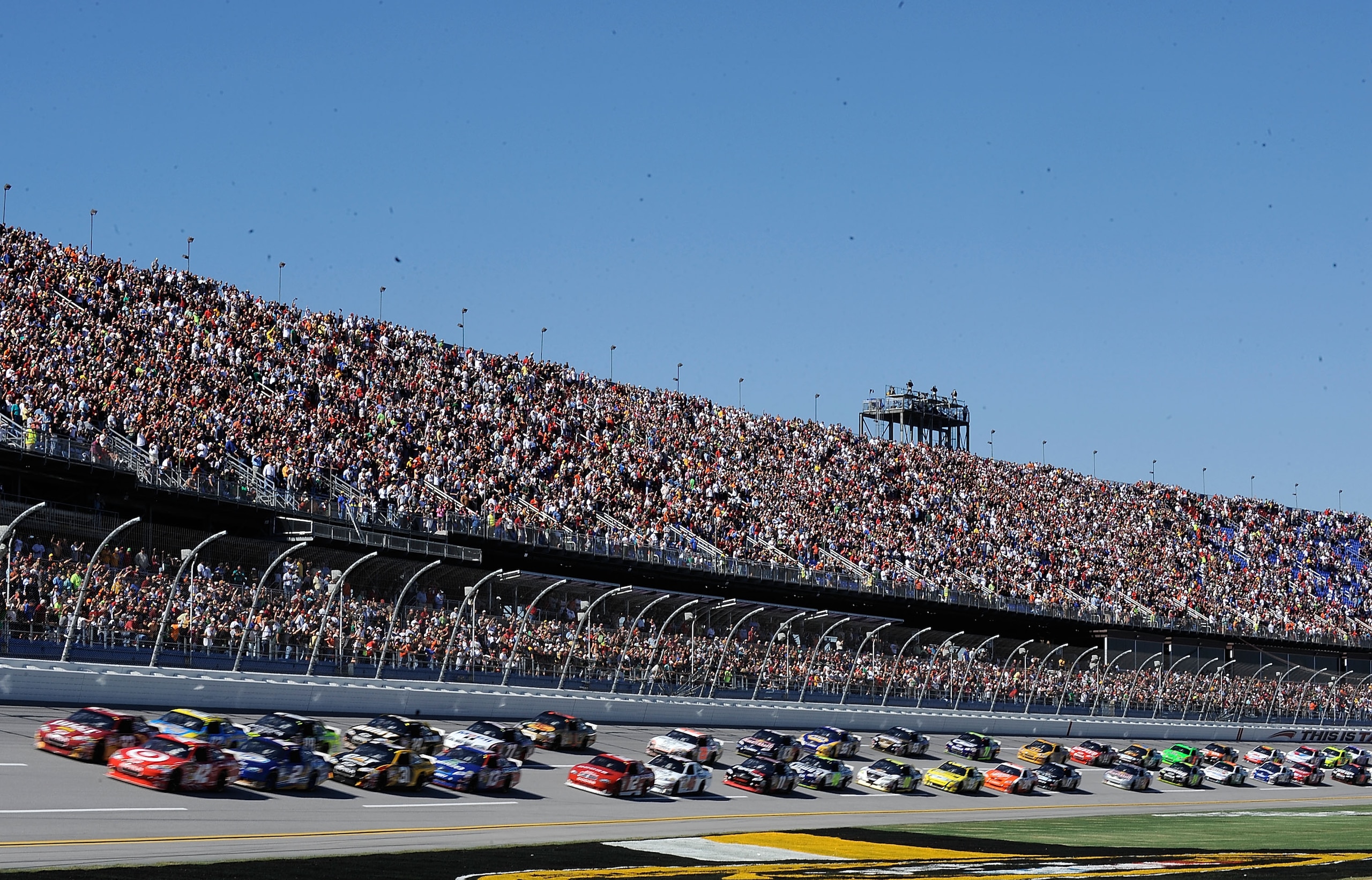 TALLADEGA, AL - OCTOBER 31:  Juan Pablo Montoya, driver of the #42 Target Chevrolet, and Clint Bowyer, driver of the #33 BB&T Chevrolet, lead the field to the green flag to start the NASCAR Sprint Cup Series AMP Energy Juice 500 at Talladega Superspeedway