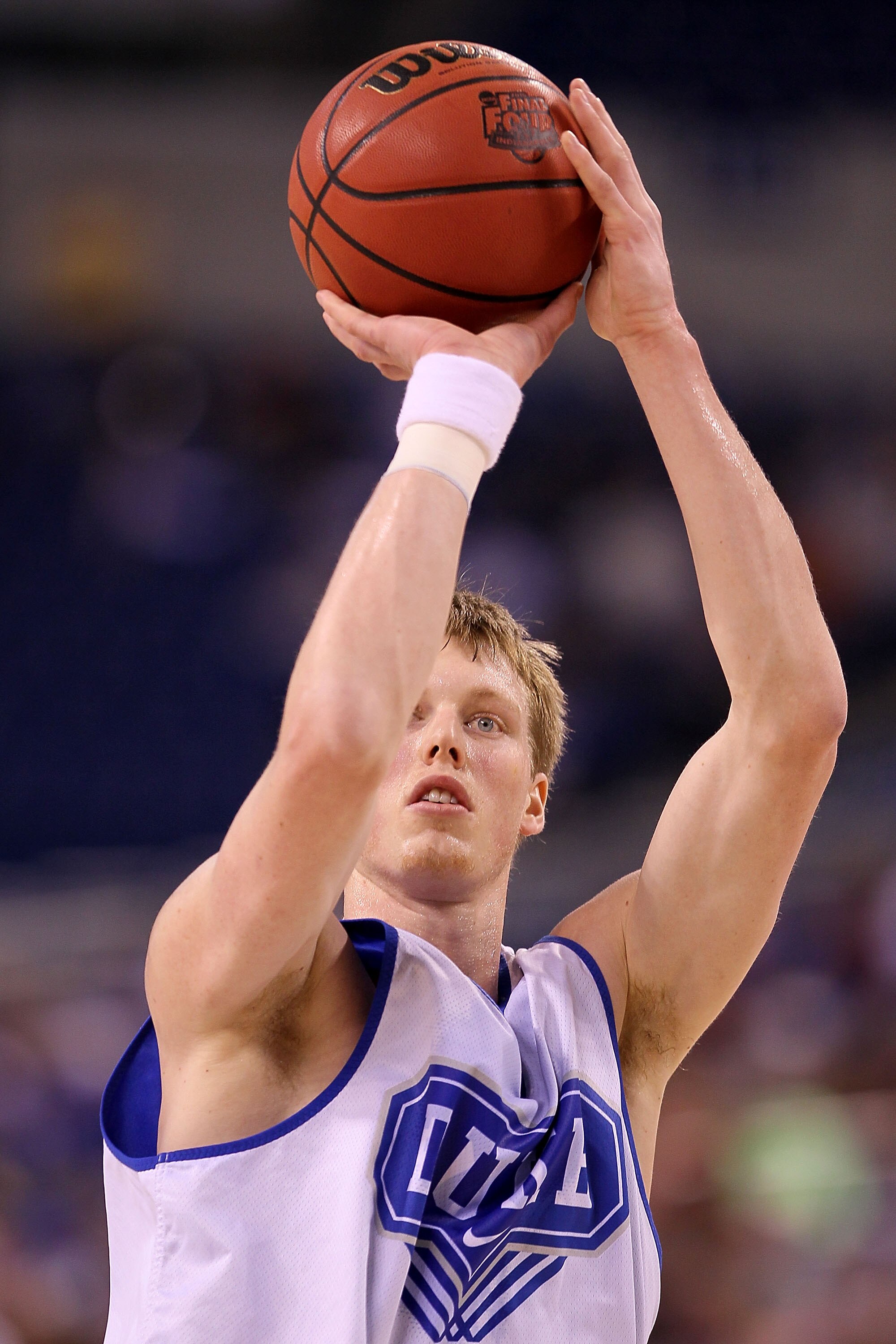 INDIANAPOLIS - APRIL 02:  Kyle Singler #12 of the Duke Blue Devils shoots the ball during practice prior to the 2010 Final Four of the NCAA Division I Men's Basketball Tournament at Lucas Oil Stadium on April 2, 2010 in Indianapolis, Indiana.  (Photo by A