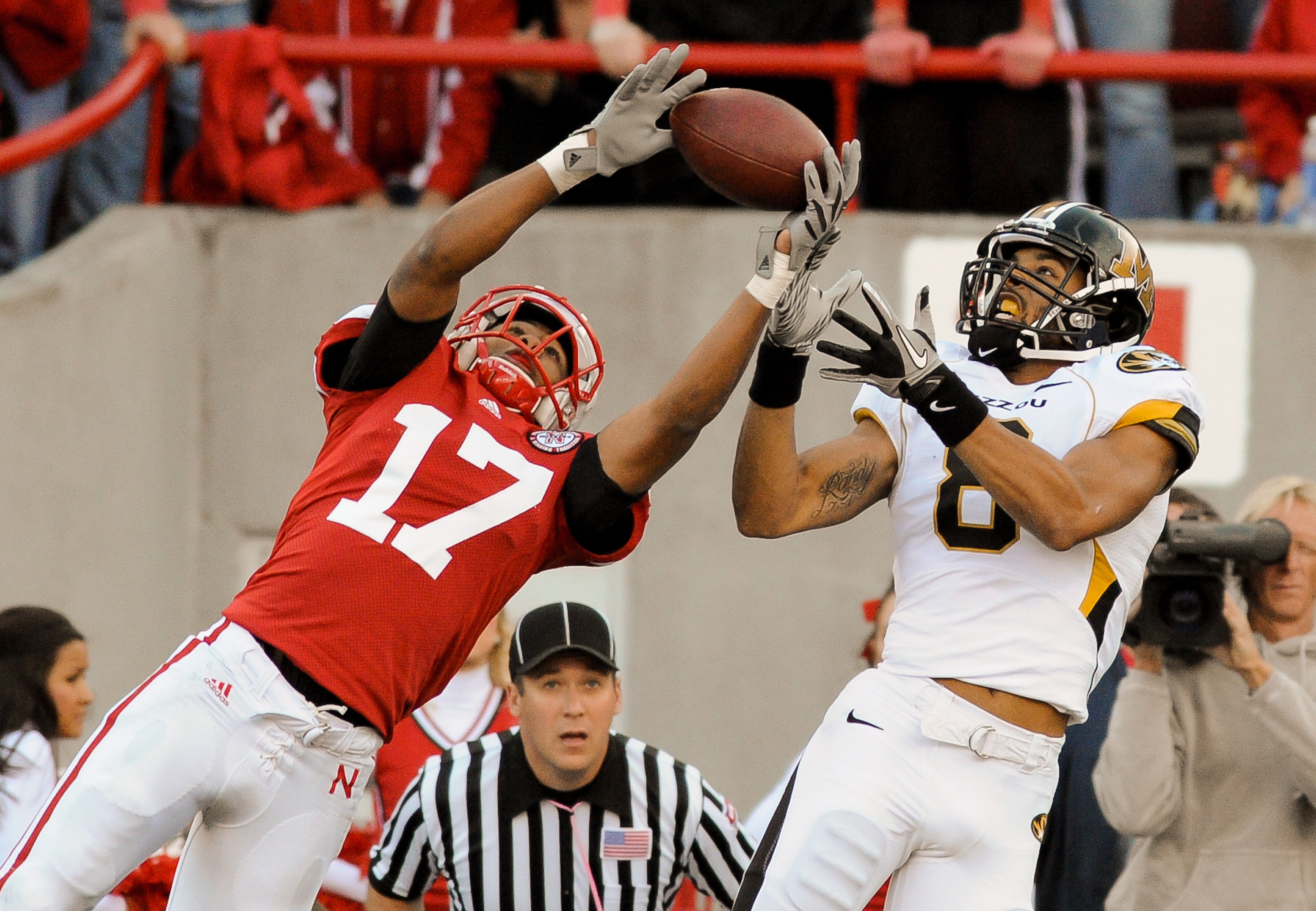 LINCOLN, NE - OCTOBER 30: Defensive back Ciante Evans #17 of the Nebraska Cornhuskers breaks up a intended for wide receiver Wes Kemp #8 of the Missouri Tigers during second half action of their game at Memorial Stadium on October 30, 2010 in Lincoln, Neb