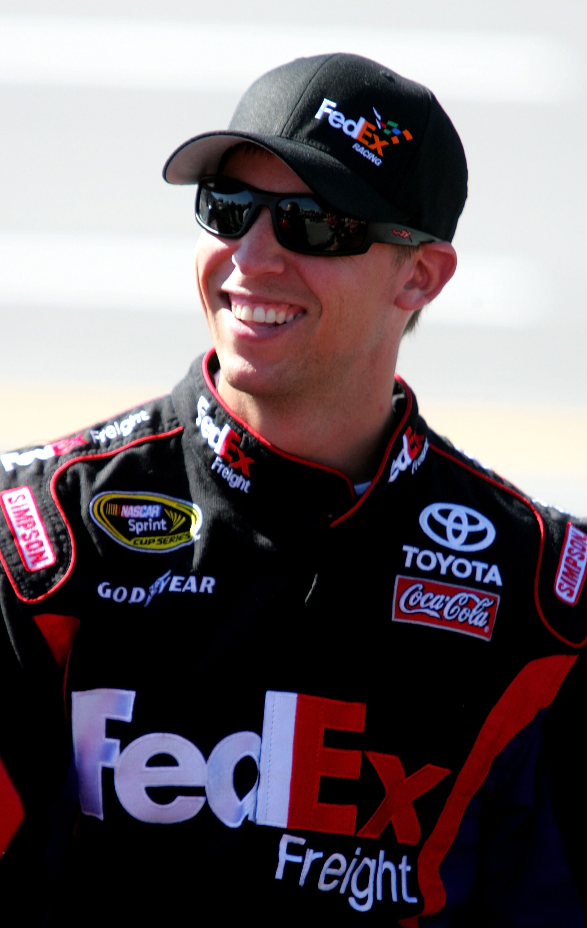 TALLADEGA, AL - OCTOBER 30:  Denny Hamlin, driver of the #11 FedEx Freight Toyota, walks on pit road during qualifying for the NASCAR Sprint Cup Series AMP Energy Juice 500 at Talladega Superspeedway on October 30, 2010 in Talladega, Alabama.  (Photo by J
