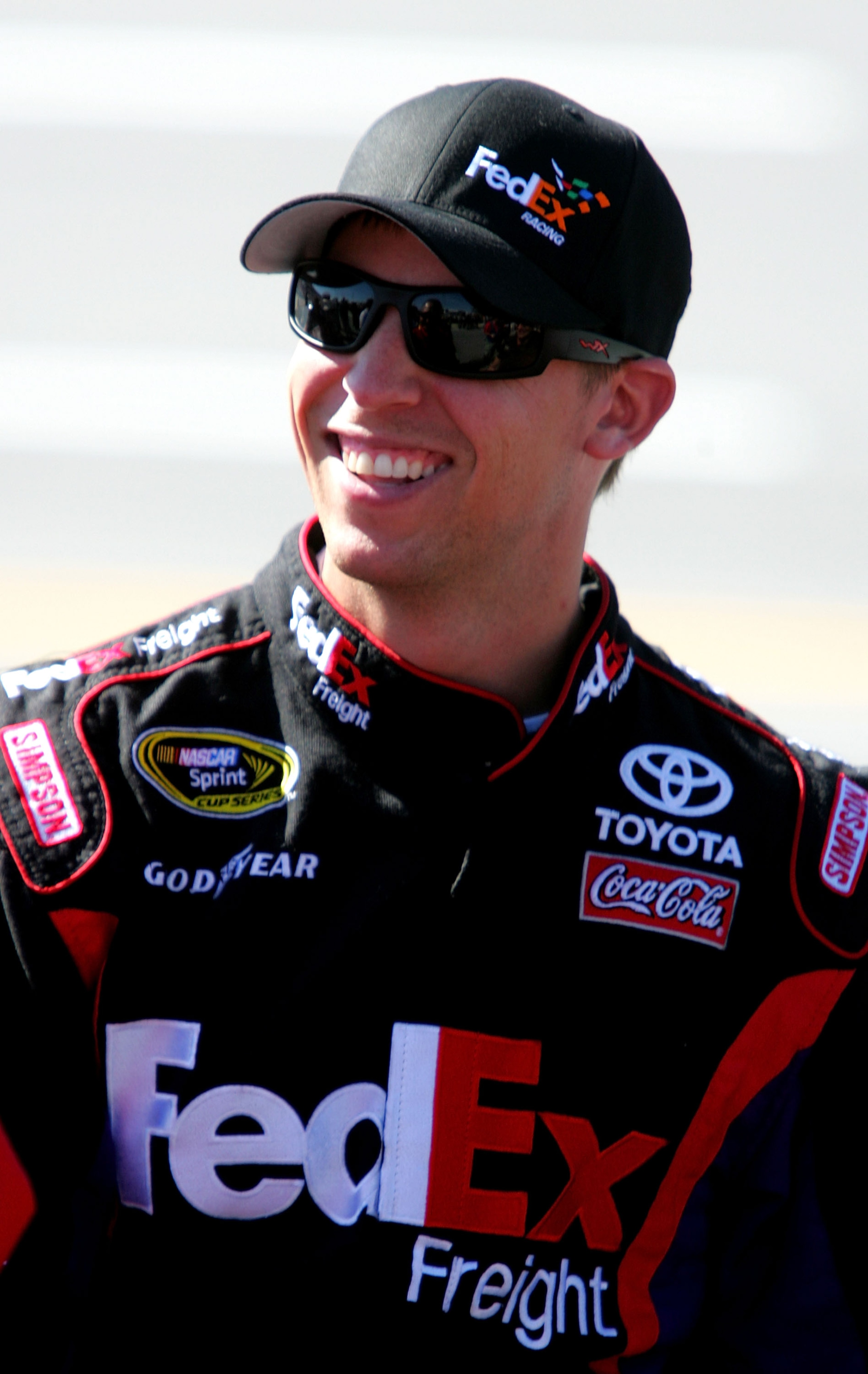 TALLADEGA, AL - OCTOBER 30:  Denny Hamlin, driver of the #11 FedEx Freight Toyota, walks on pit road during qualifying for the NASCAR Sprint Cup Series AMP Energy Juice 500 at Talladega Superspeedway on October 30, 2010 in Talladega, Alabama.  (Photo by J