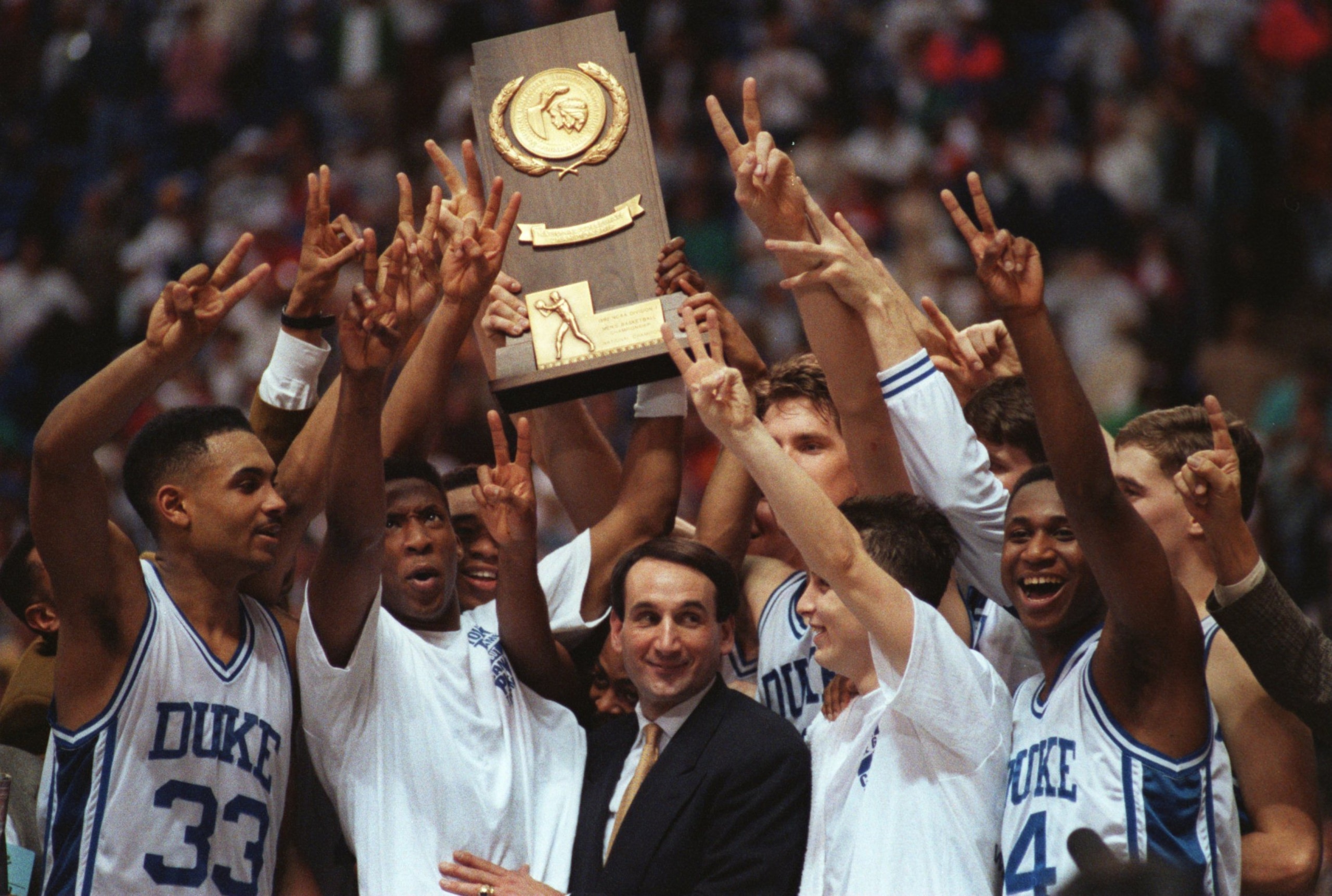 APR 1992:  COACHES AND TEAM MEMBERS OF THE 1992 DUKE UNIVERSITY BASKETBALL TEAM CELEBRATE THEIR NCAA NATIONAL CHAMPIONSHIP IN MINNEAPOLIS, MINNESOTA. Mandatory Credit: Jonathan Daniel/ALLSPORT