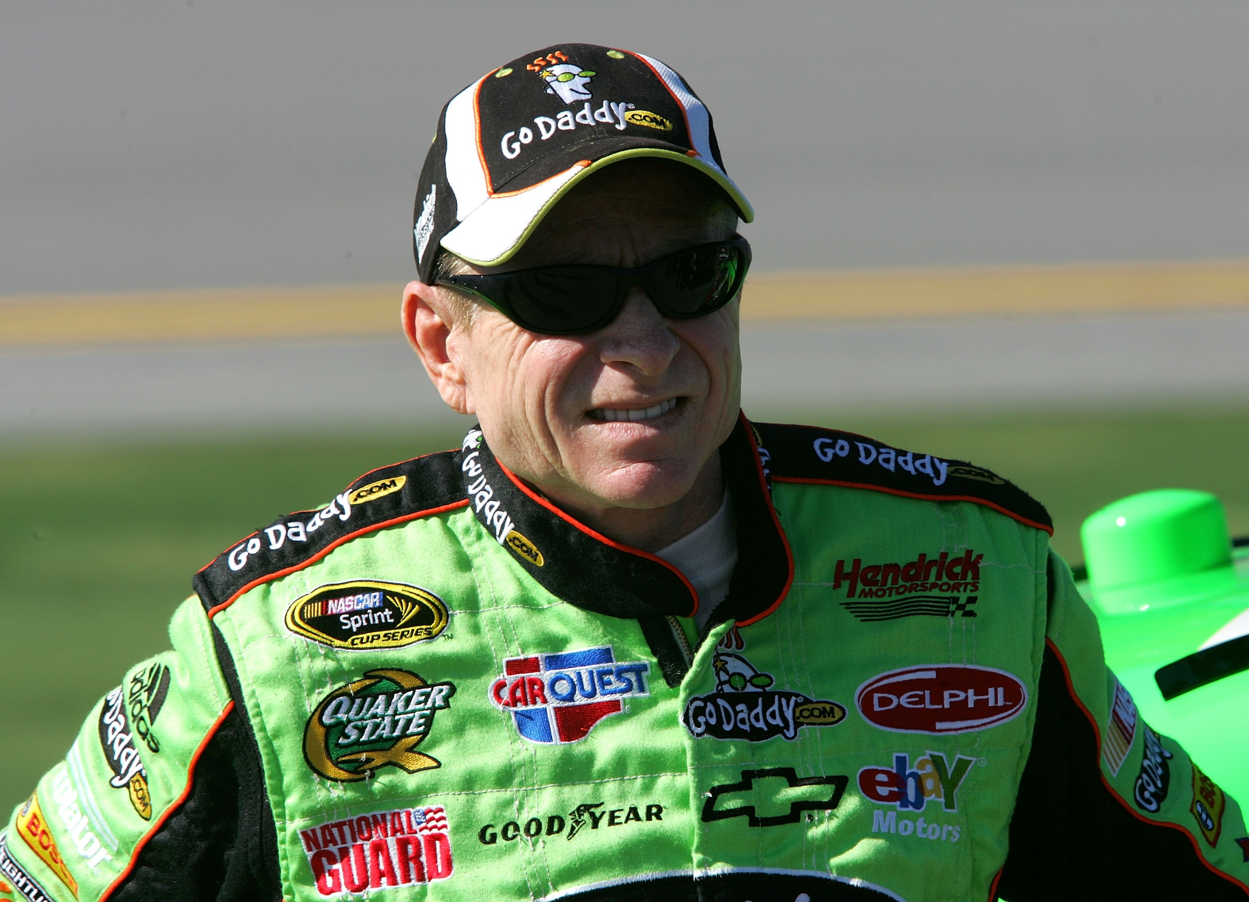 TALLADEGA, AL - OCTOBER 30:  Mark Martin, driver of the #5 GoDaddy.com Chevrolet, stands next to his car on pit road during qualifying for the NASCAR Sprint Cup Series AMP Energy Juice 500 at Talladega Superspeedway on October 30, 2010 in Talladega, Alaba