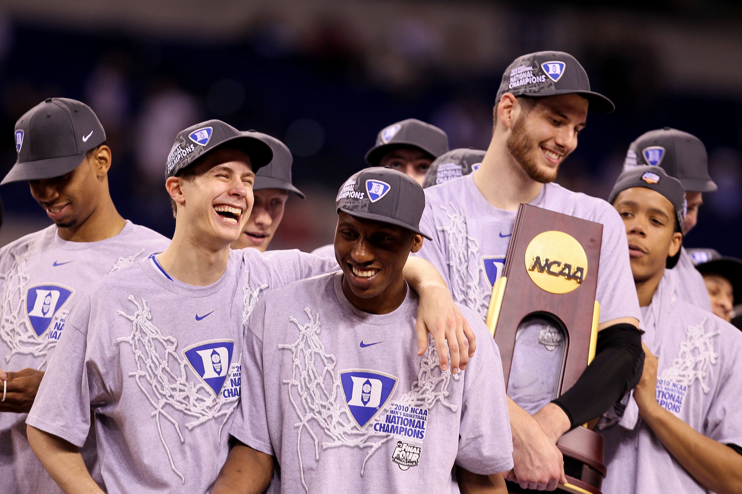 INDIANAPOLIS - APRIL 05:  (L-R) Jon Scheyer #30, Nolan Smith #2 and Brian Zoubek #55 of the Duke Blue Devils celebrate with the trophy after they won 61-59 against the Butler Bulldogs during the 2010 NCAA Division I Men's Basketball National Championship