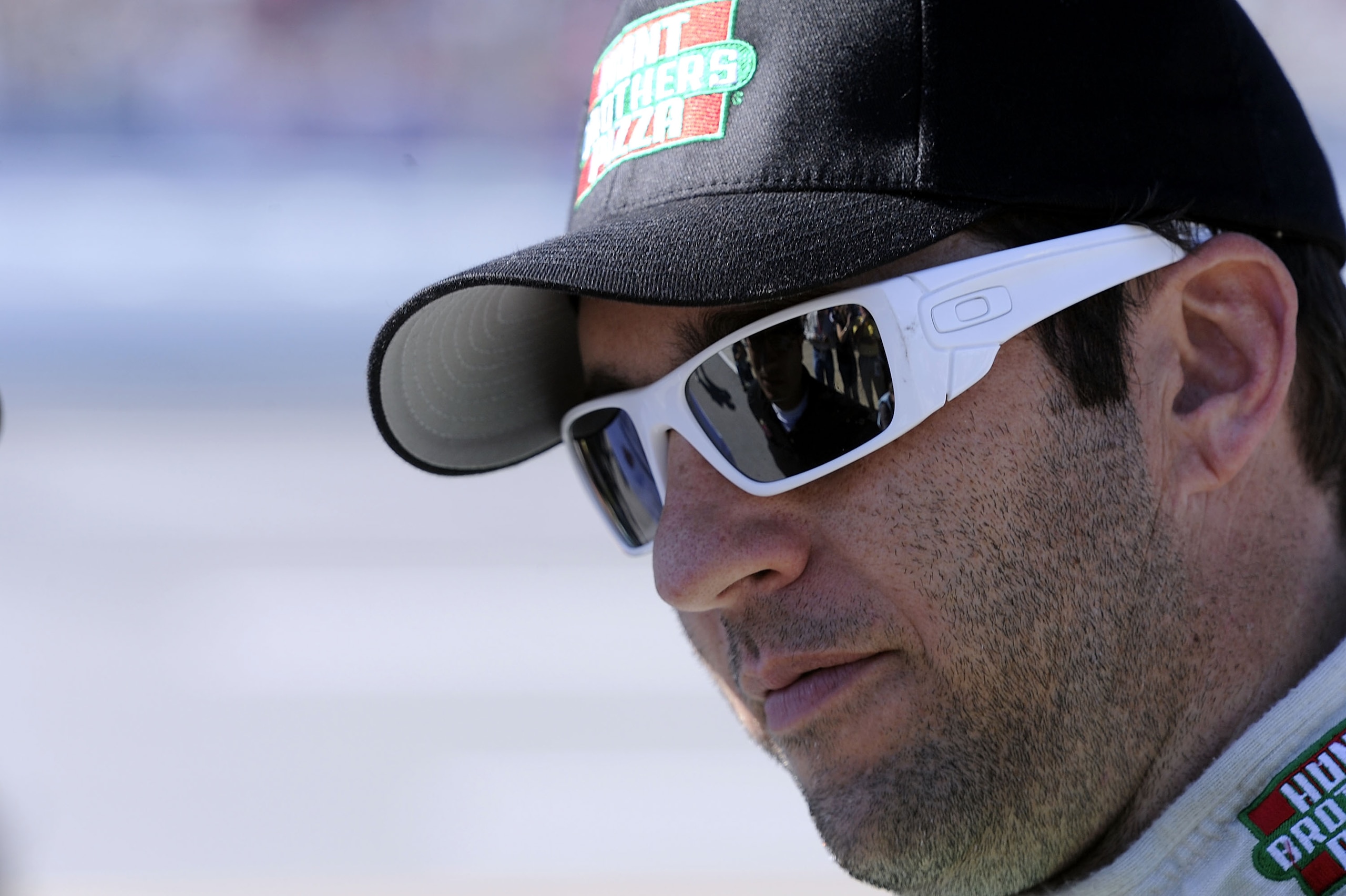 TALLADEGA, AL - OCTOBER 30:  Elliott Sadler, driver of the #19 Hunt Brother Pizza Ford, watches qualifying for the NASCAR Sprint Cup Series AMP Energy Juice 500 at Talladega Superspeedway on October 30, 2010 in Talladega, Alabama.  (Photo by John Harrelso