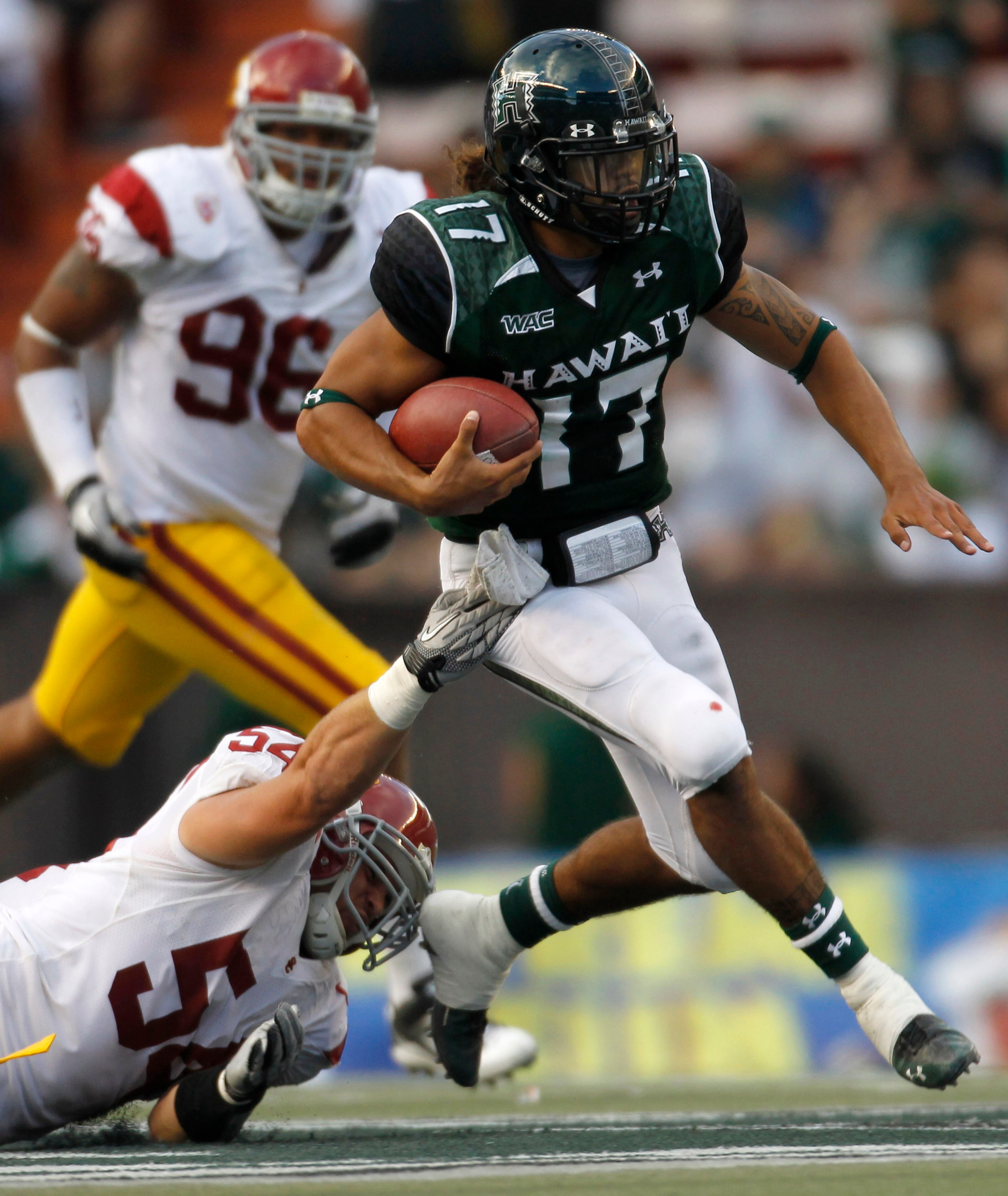 HONOLULU - SEPTEMBER 02: Bryant Moniz #17 of the University of Hawaii Warriors carries the ball during first half action against the University of Southern California Trojans at Aloha Stadium September 2, 2010 in Honolulu, Hawaii. (Photo by Kent Nishimura