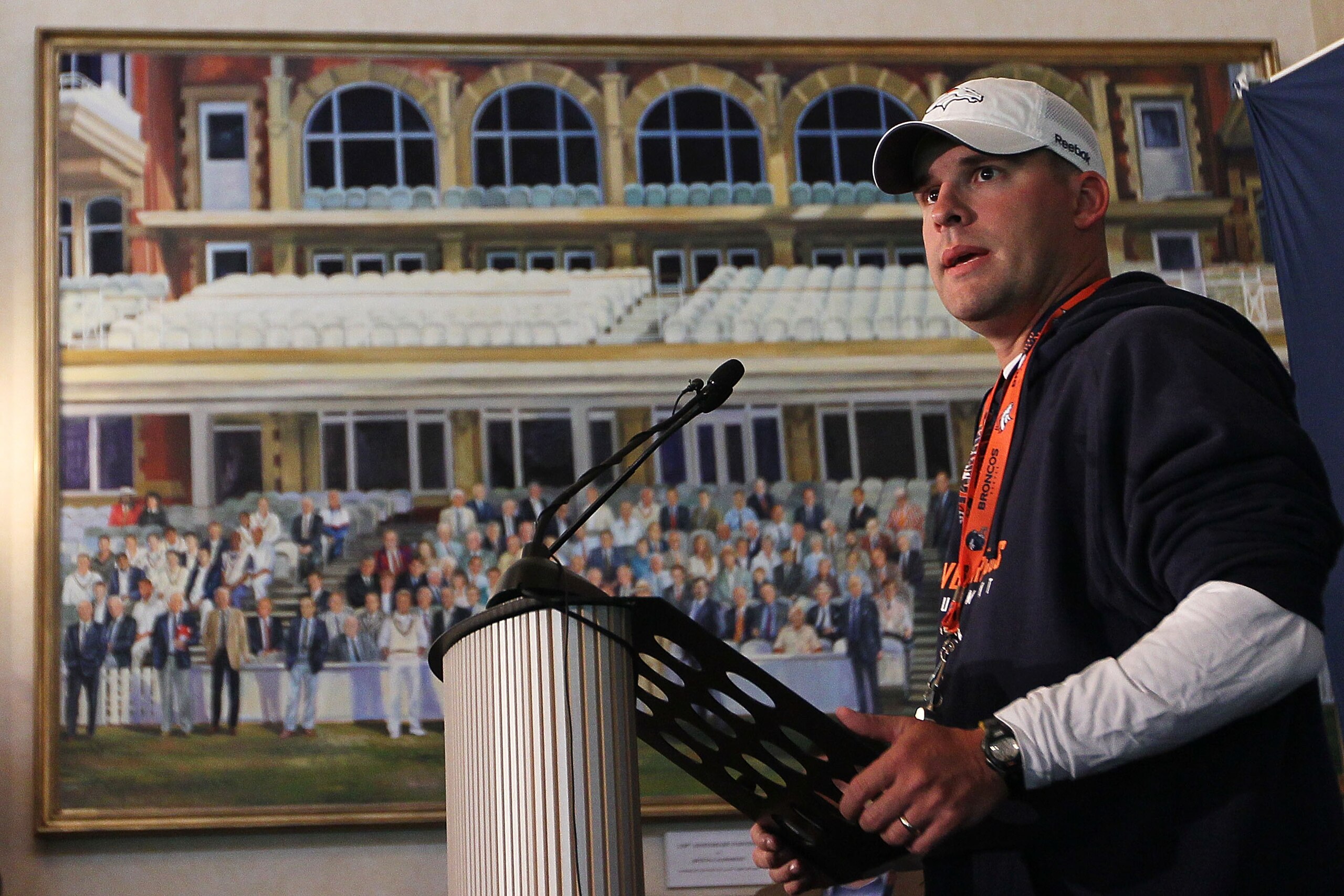 LONDON, ENGLAND - OCTOBER 29:  Head coach of the Denver Broncos Josh McDaniels speaks to the media during a press conference prior to the start of a team training session at The Brit Oval on October 29, 2010 in London, England. The Denver Broncos will pla