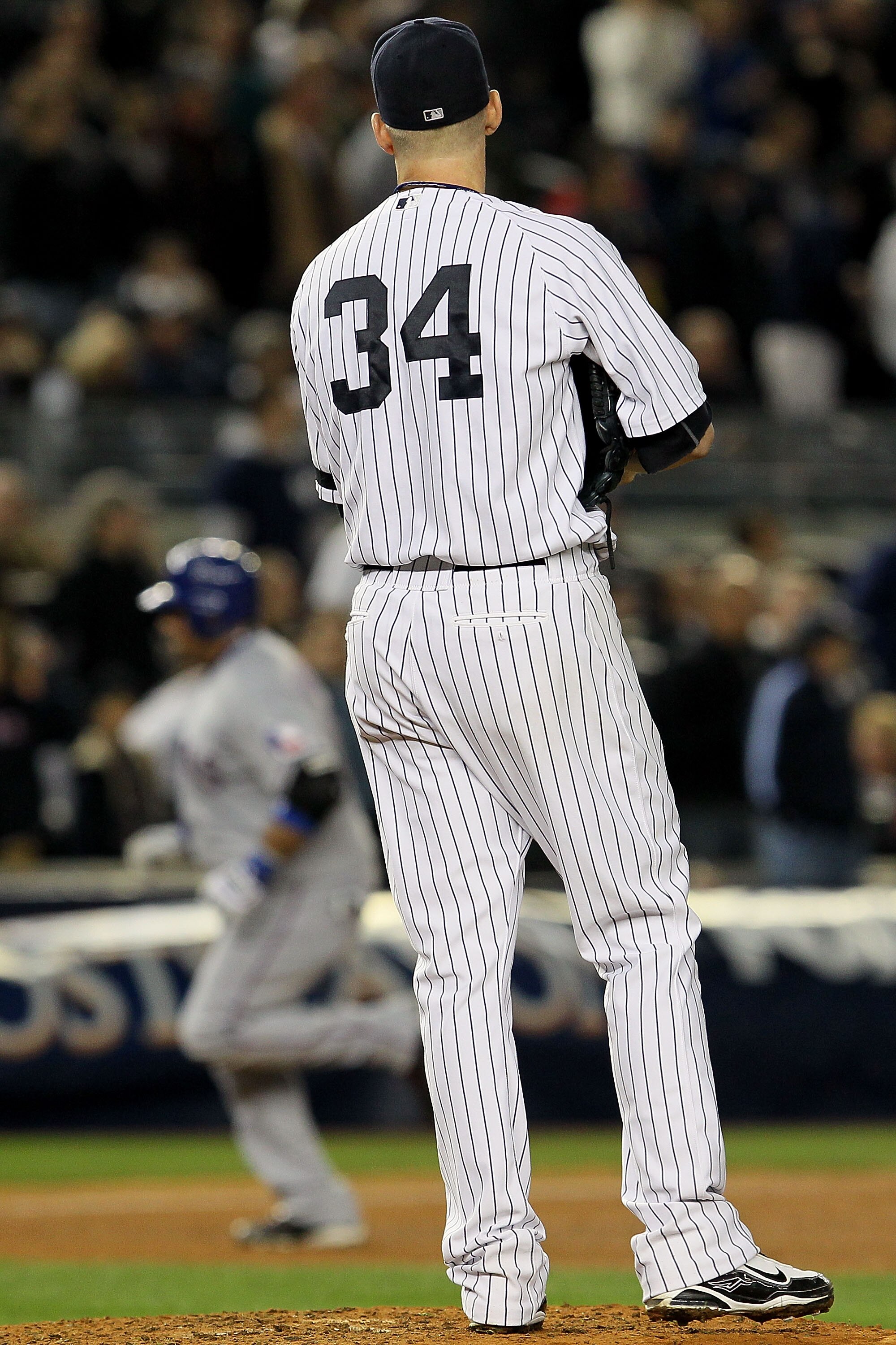 NEW YORK - OCTOBER 19:  Bengie Molina #11 of the Texas Rangers rounds the bases after hitting a three-run home run in the top of the sixth inning against A.J. Burnett #34 of the New York Yankees  in Game Four of the ALCS during the 2010 MLB Playoffs at Ya