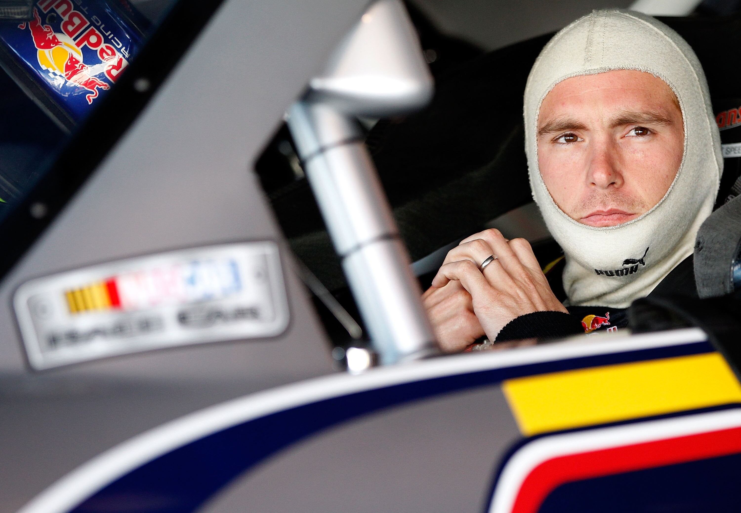 MARTINSVILLE, VA - OCTOBER 23:  Scott Speed, driver of the #82 Red Bull Toyota, sits in his car in the garage during practice for the NASCAR Sprint Cup Series TUMS Fast Relief 500 at Martinsville Speedway on October 23, 2010 in Martinsville, Virginia.  (P