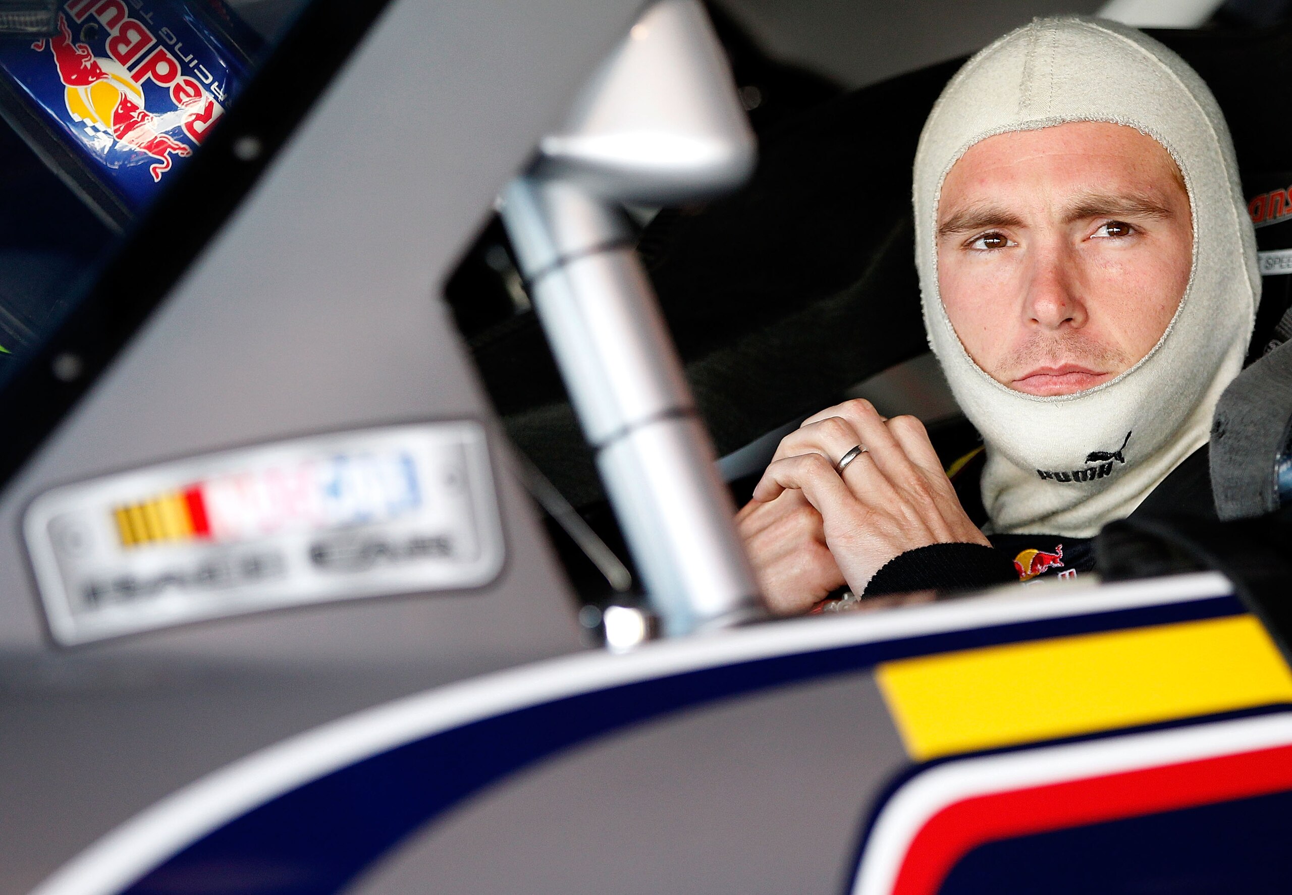 MARTINSVILLE, VA - OCTOBER 23:  Scott Speed, driver of the #82 Red Bull Toyota, sits in his car in the garage during practice for the NASCAR Sprint Cup Series TUMS Fast Relief 500 at Martinsville Speedway on October 23, 2010 in Martinsville, Virginia.  (P