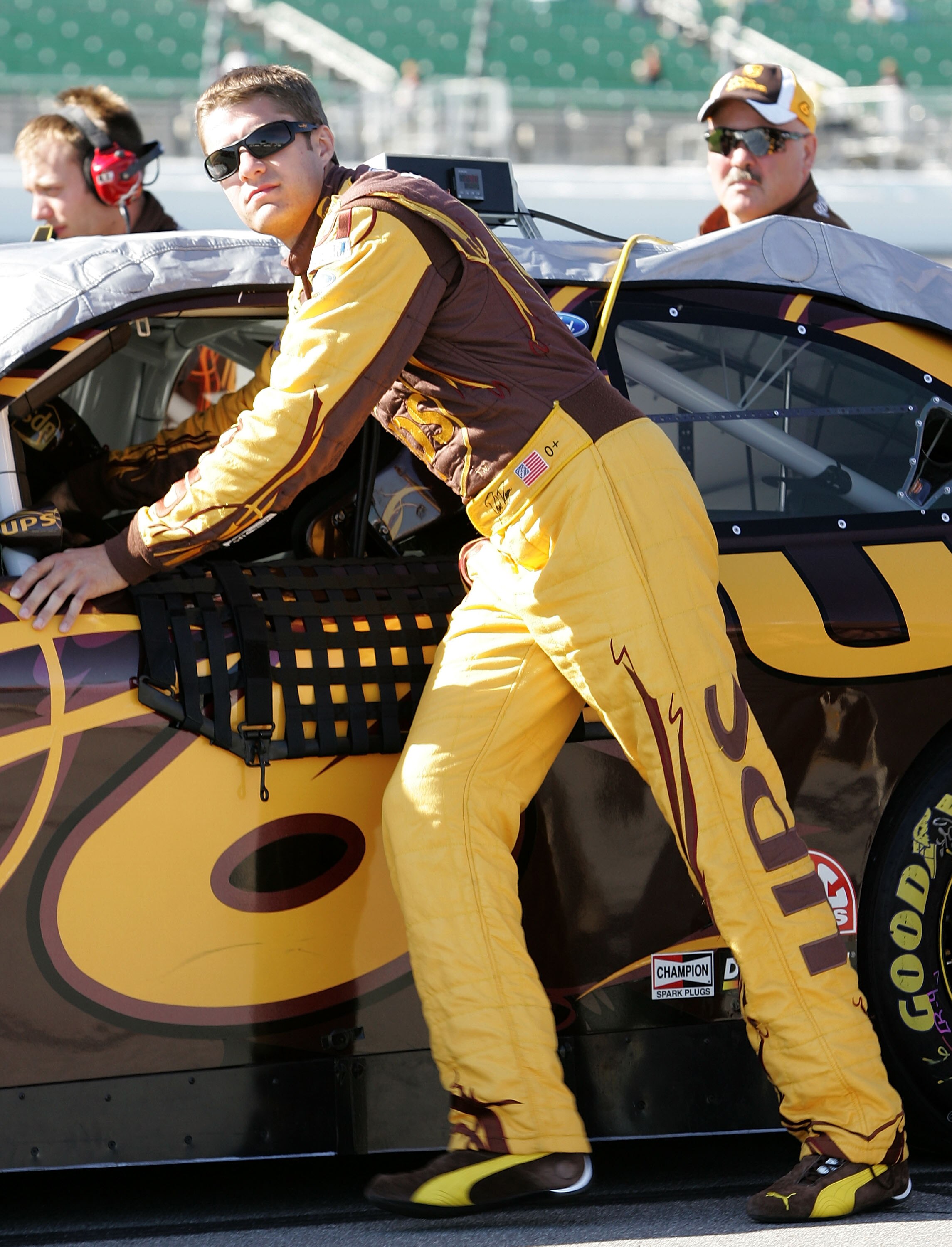 KANSAS CITY, KS - OCTOBER 01:  David Ragan, driver of the #6 UPS Ford, pushes his car on pit road during qualifying for the NASCAR Sprint Cup Series Price Chopper 400 on October 1, 2010 in Kansas City, Kansas.  (Photo by Christa Thomas/Getty Images for NA
