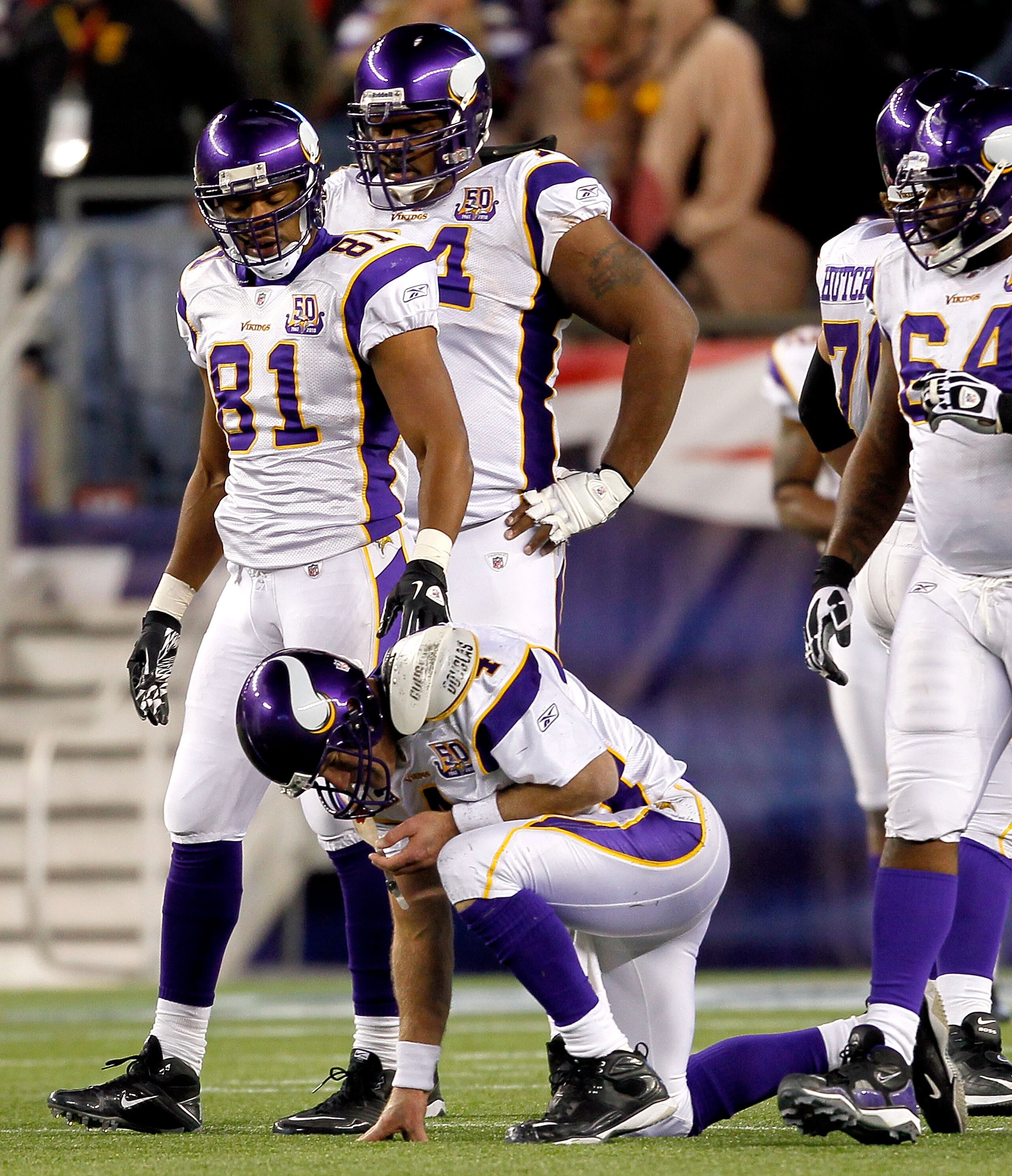 FOXBORO, MA - OCTOBER 31:  Brett Favre #4 of the Minnesota Vikings has difficulty walking to the bench after he was hit by Myron Pryor #91 of the New England Patriots in the fourth quarter at Gillette Stadium on October 31, 2010 in Foxboro, Massachusetts.