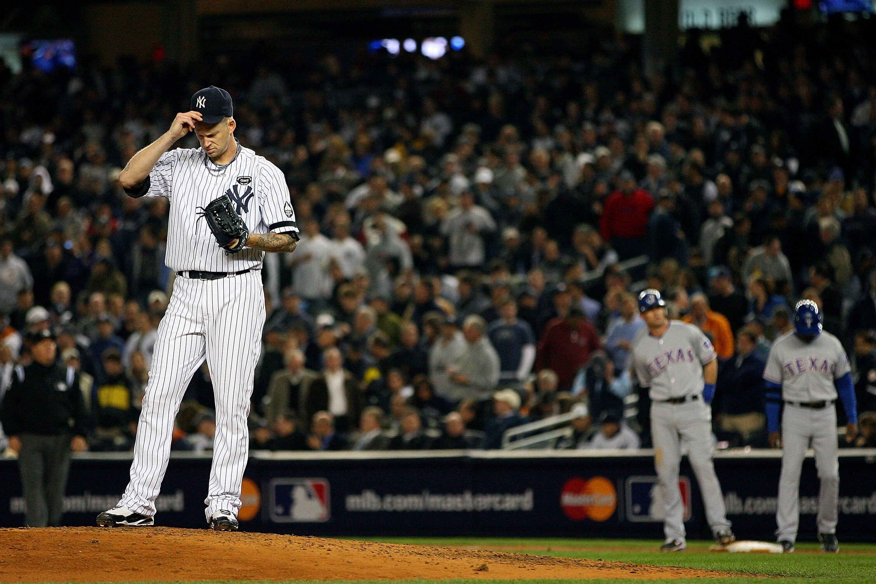 NEW YORK - OCTOBER 19:  A.J. Burnett #34 of the New York Yankees adjusts his hat while playing against the Texas Rangers in Game Four of the ALCS during the 2010 MLB Playoffs at Yankee Stadium on October 19, 2010 in the Bronx borough of New York City.  (P