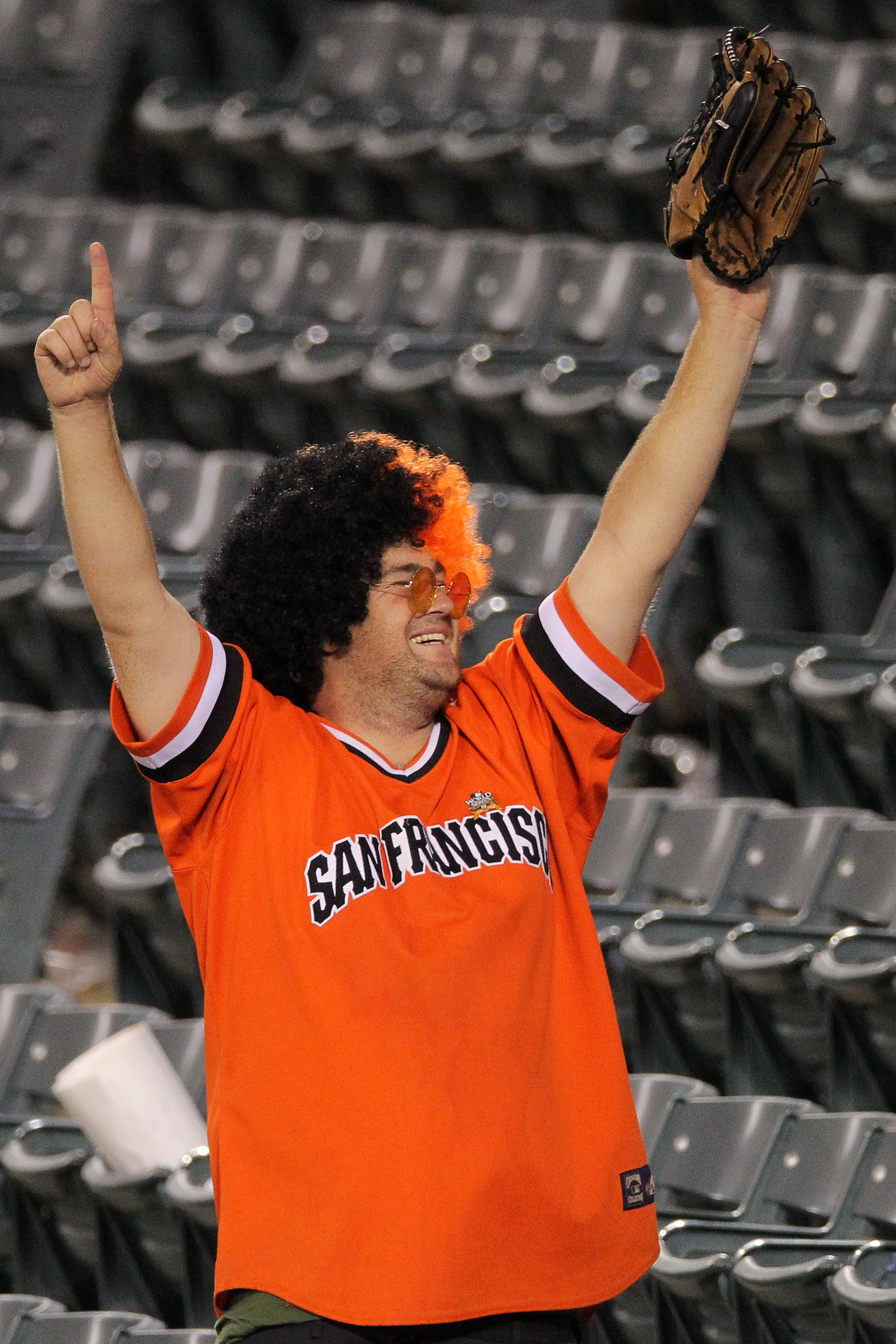 ARLINGTON, TX - OCTOBER 31:  A fan of the San Francisco Giants celebrates their 4-0 victory over  the Texas Rangers in Game Four of the 2010 MLB World Series at Rangers Ballpark in Arlington on October 31, 2010 in Arlington, Texas.  (Photo by Doug Pensing