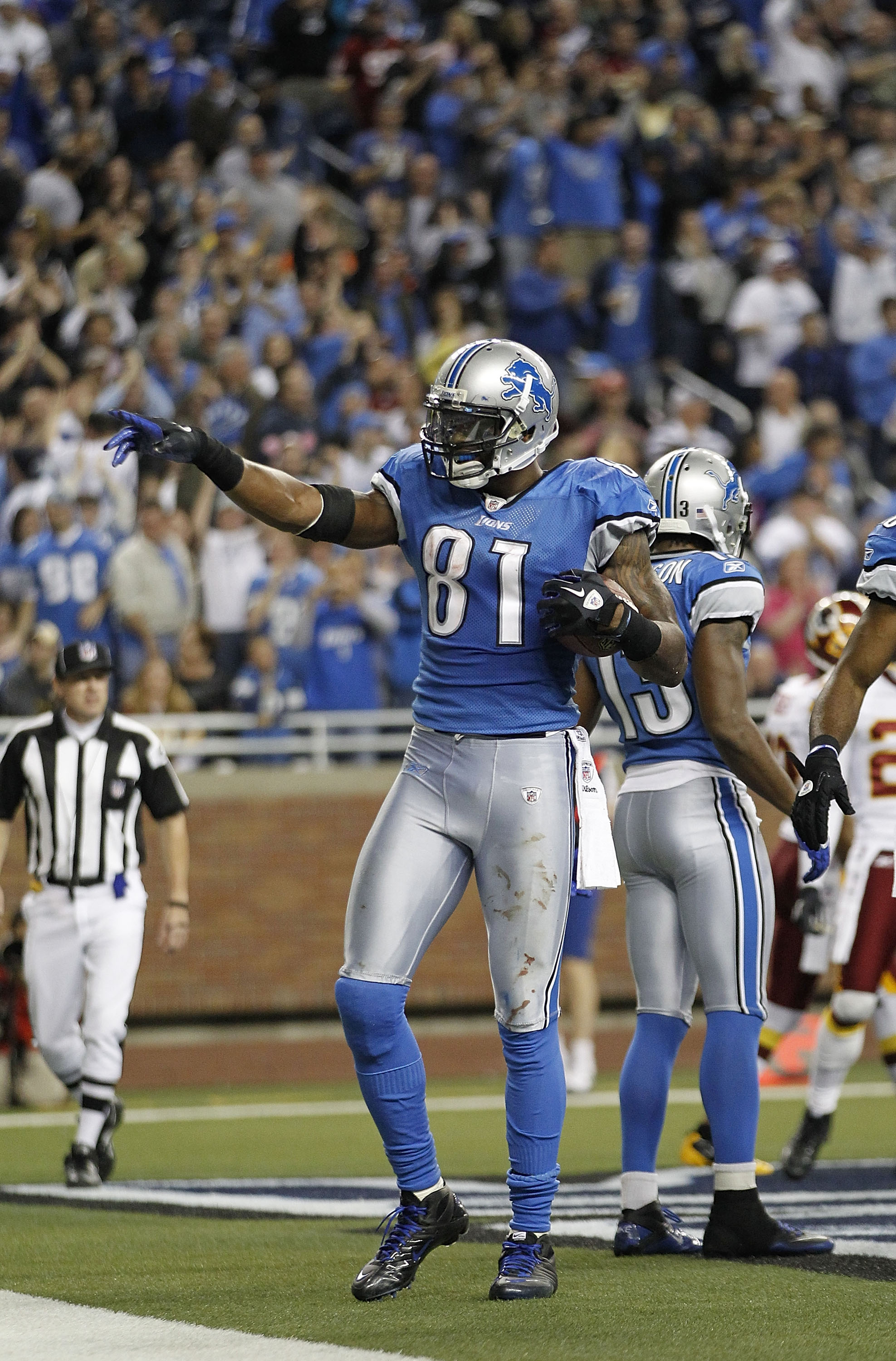 DETROIT - OCTOBER 31:  Calvin Johnson #81 of the Detroit Lions celebrates after scoring a touchdown during the fourth quarter of the game against the Washington Redskins at Ford Field on October 31, 2010 in Detroit, Michigan. The Lions defeated the Redski