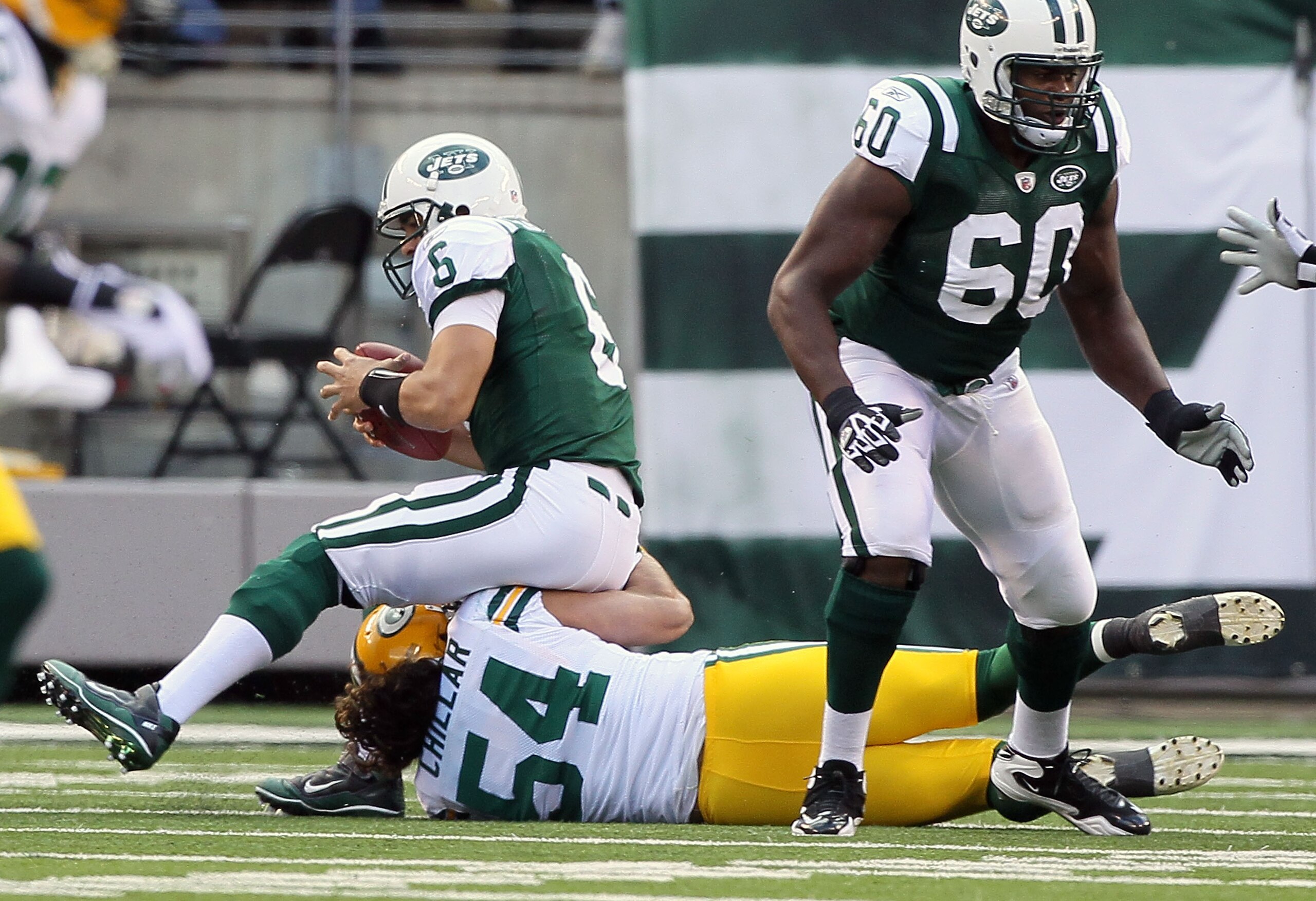 EAST RUTHERFORD, NJ - OCTOBER 31: Mark Sanchez #6 of the New York Jets is sacked by Brandon Chillar #54 of the Green Bay Packers on October 31, 2010 at the New Meadowlands Stadium in East Rutherford, New Jersey. The Packers defeated the Jets 9-0. (Photo b