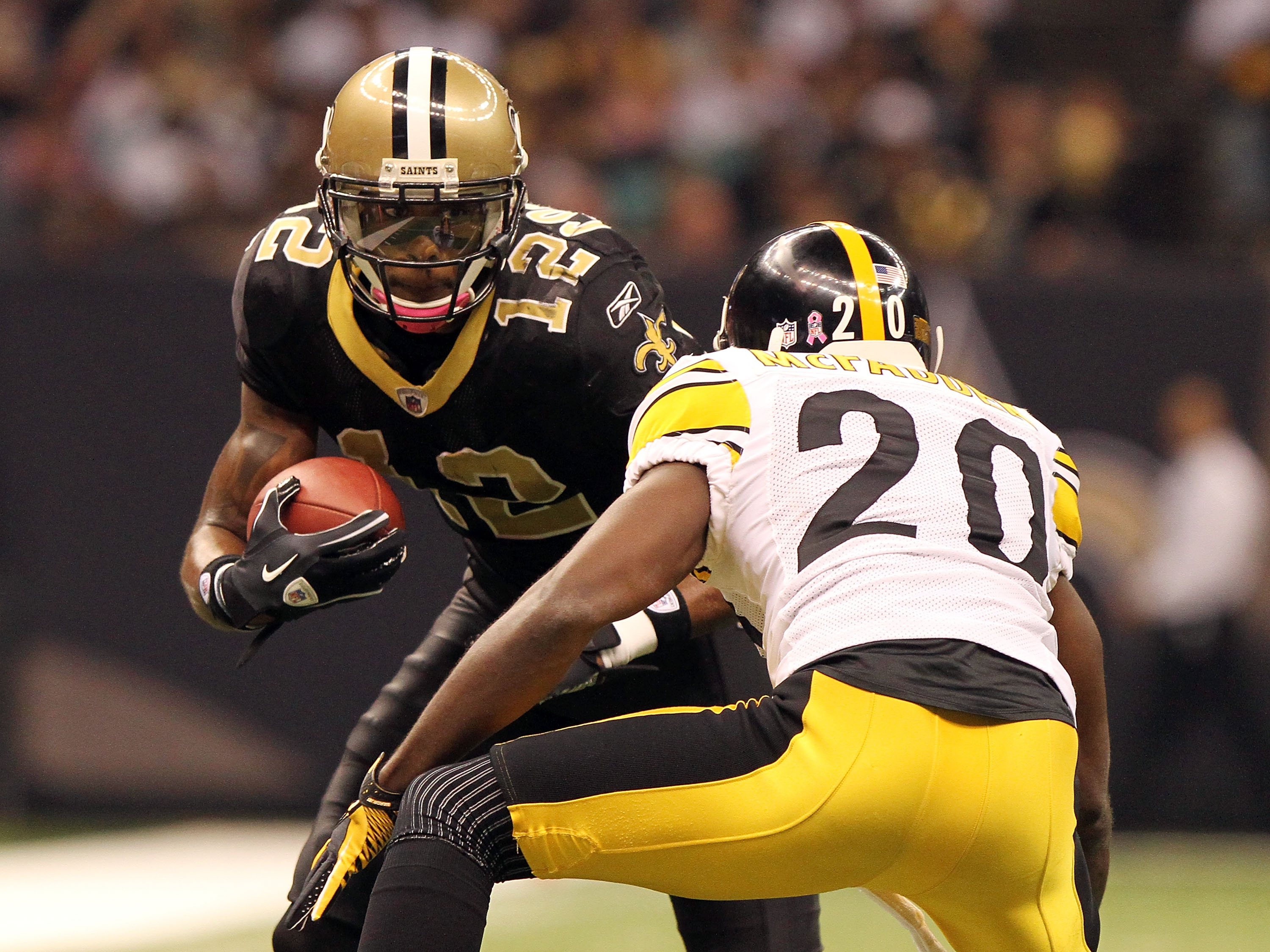 NEW ORLEANS - OCTOBER 31: Marques Colston #12 of the New Orleans Saints is tackled by Bryant McFadden #20 of the Pittsburgh Steelers at the Louisiana Superdome on October 31, 2010 in New Orleans, Louisiana. (Photo by Matthew Sharpe/Getty Images)