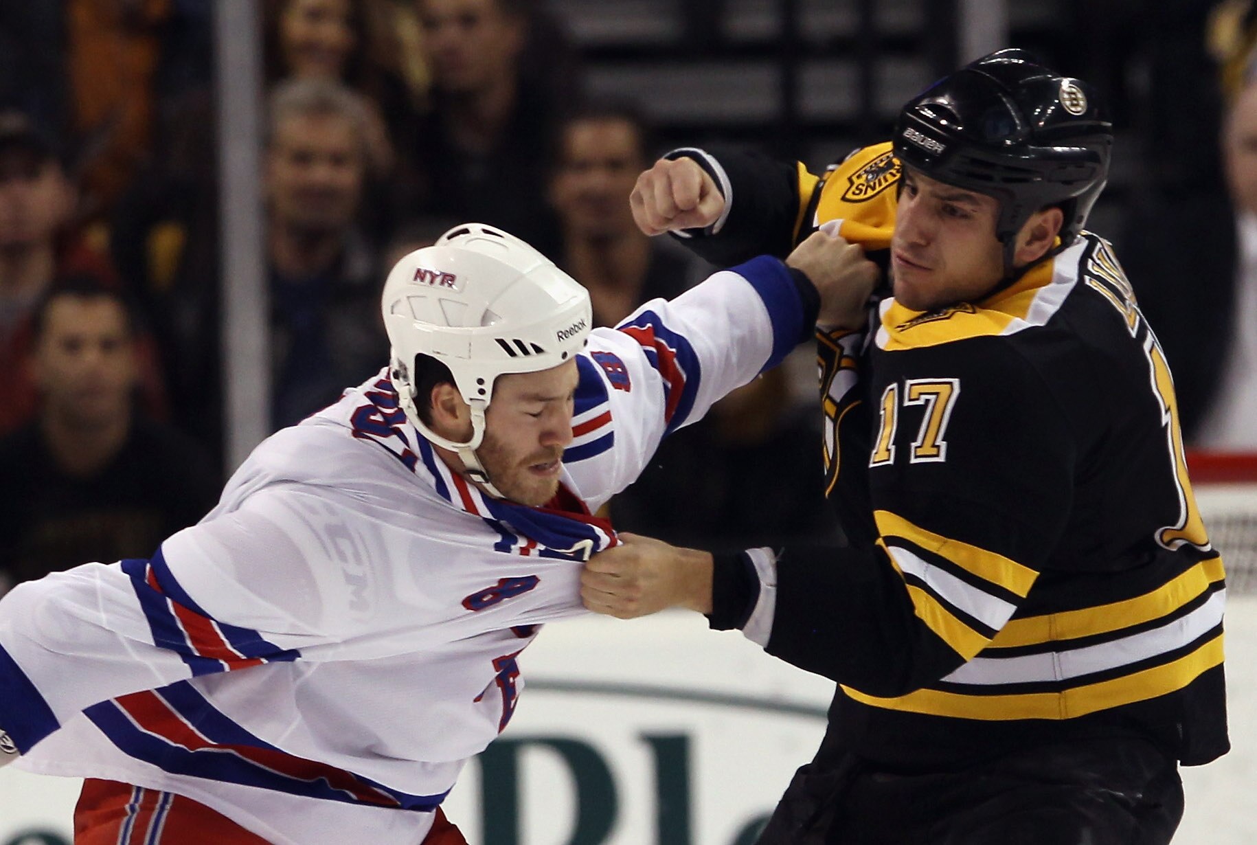 BOSTON - OCTOBER 23: Brandon Prust #8 of the New York Rangers and Milan Lucic #17 of the Boston Bruins fight during the first period at the TD Garden on October 23, 2010 in Boston, Massachusetts.  (Photo by Bruce Bennett/Getty Images)