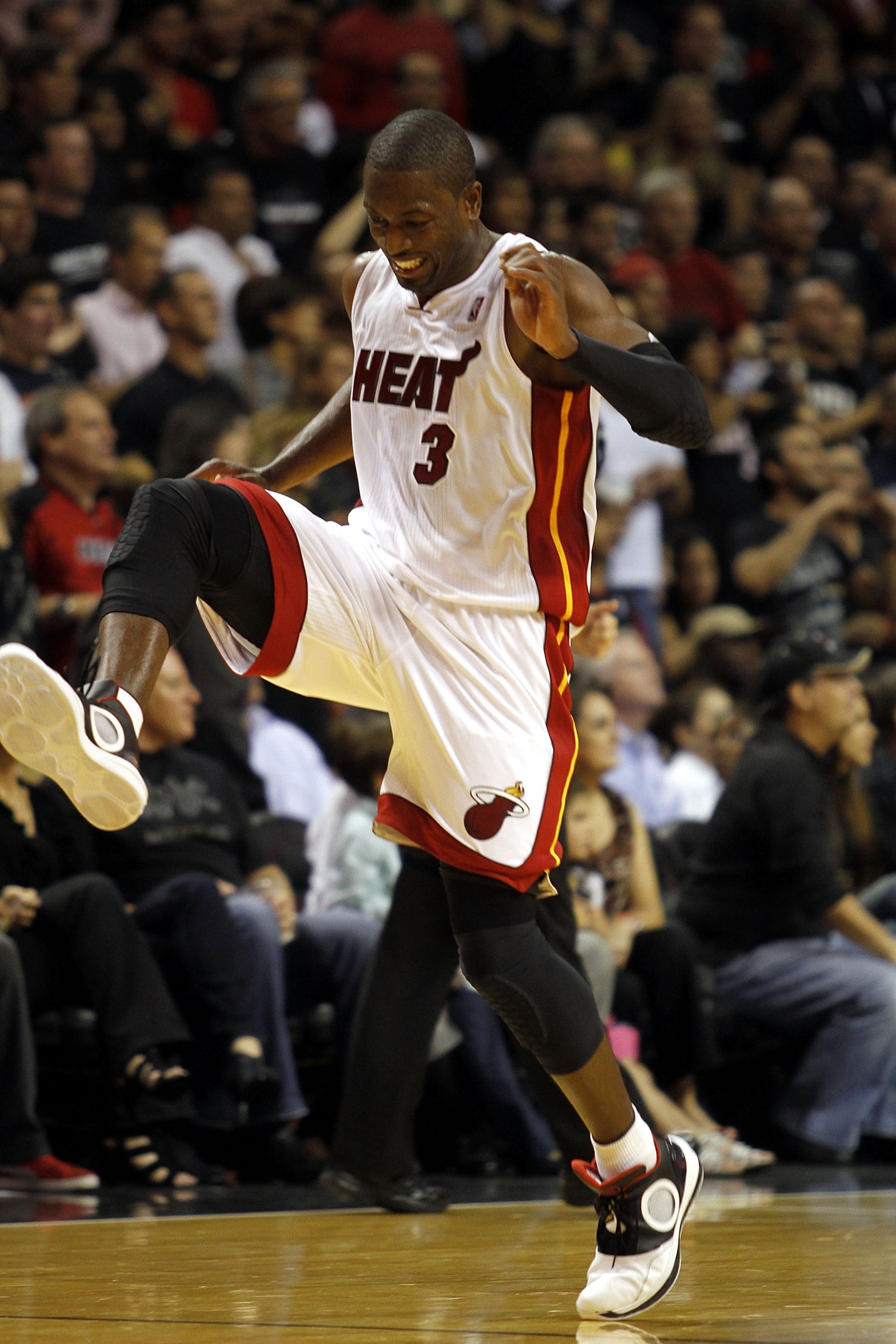 MIAMI - OCTOBER 29:  Guard Dwyane Wade #3 of  the Miami Heat reacts against the Orlando Magic at American Airlines Arena on October 29, 2010 in Miami, Florida.  NOTE TO USER: User expressly acknowledges and agrees that, by downloading and or using this ph