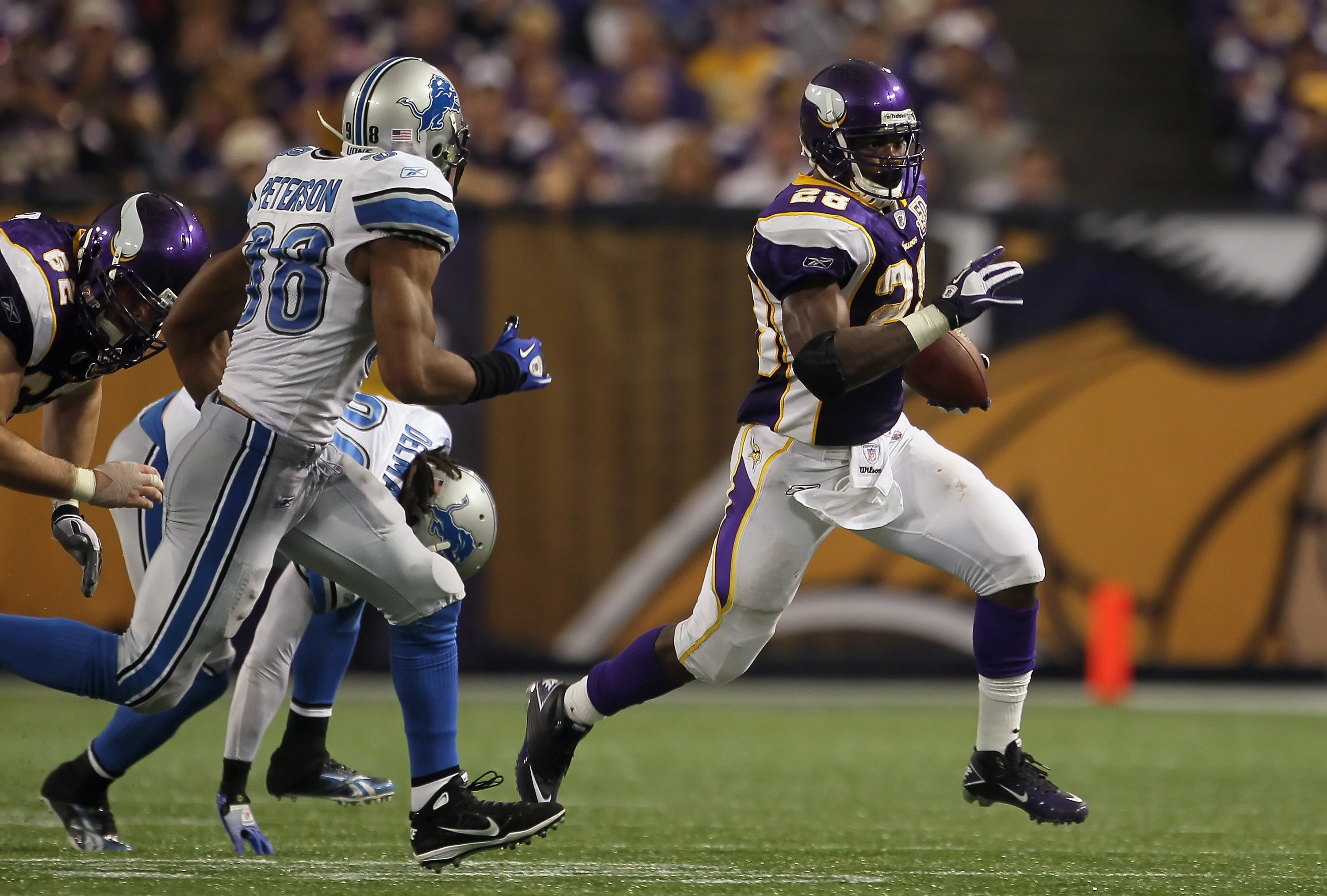 MINNEAPOLIS - SEPTEMBER 26:  Running back Adrian Peterson #28 of the Minnesota Vikings carries the ball against the Detroit Lions at Mall of America Field on September 26, 2010 in Minneapolis, Minnesota. The Vikings defeated the Lions 24-10.  (Photo by Je
