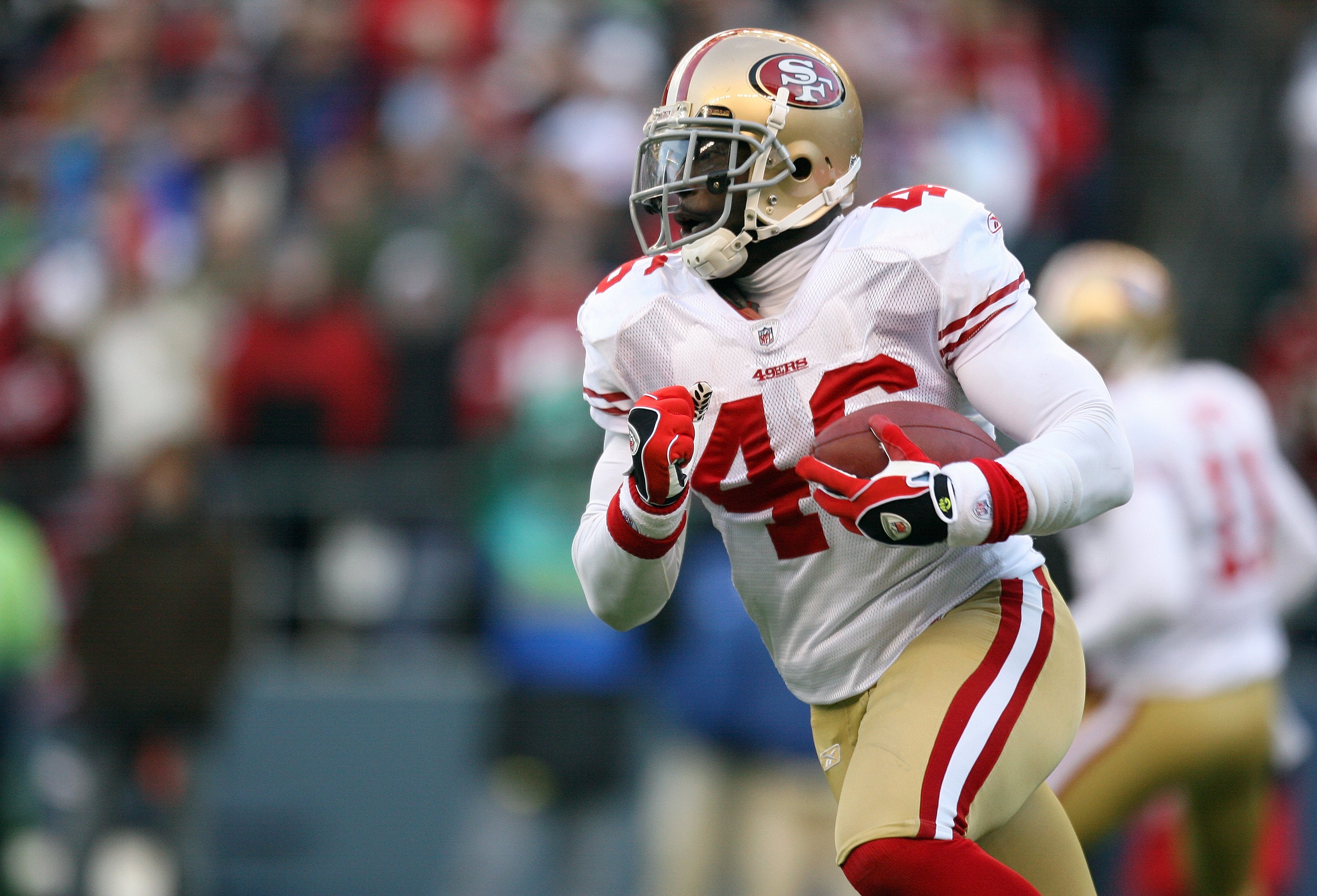 SEATTLE - DECEMBER 6:  Delanie Walker #46 of the San Francisco 49ers runs with the ball during their NFL game against the Seattle Seahawks on December 6, 2009 at Qwest Field in Seattle, Washington. The Seahawks defeated the 49ers 20-17. (Photo by Otto Gre