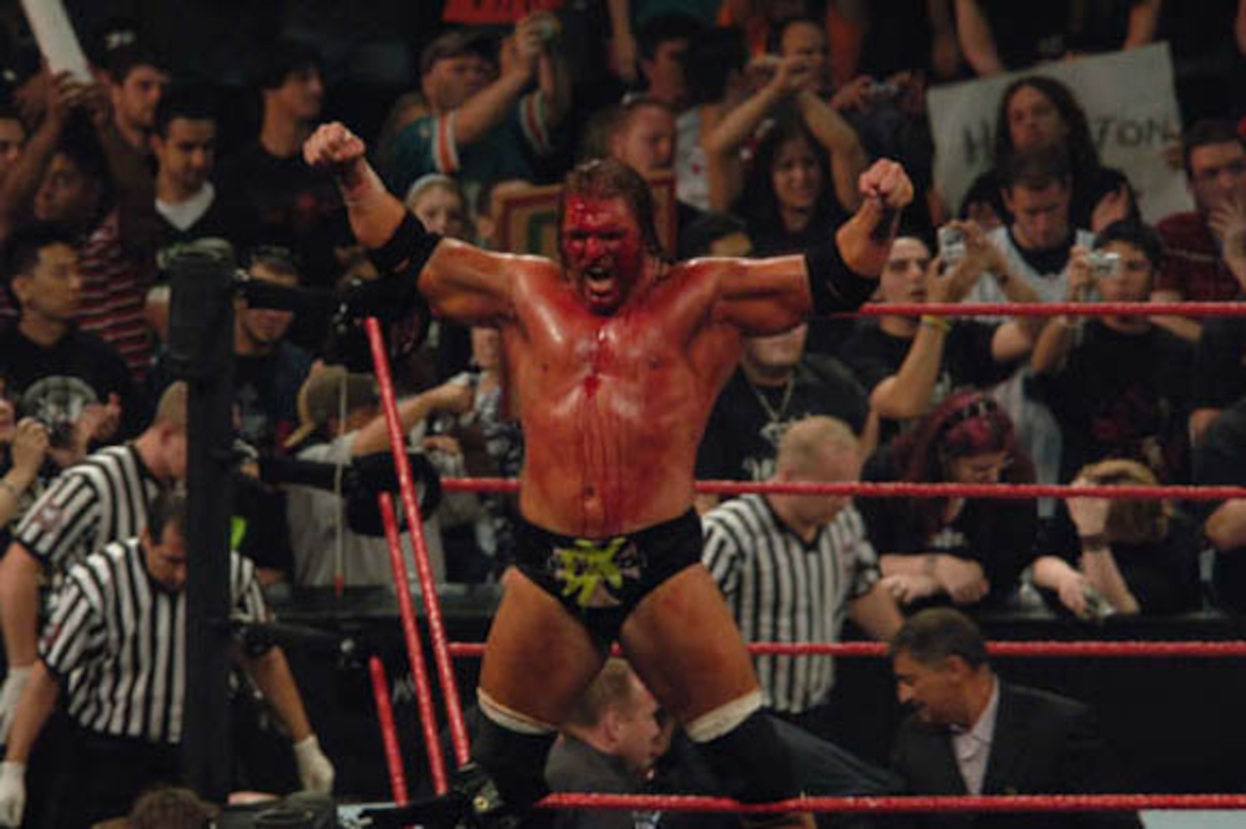 HHH bloody after a Hell In A Cell victory, but would histor repeat itself against the Undertaker?