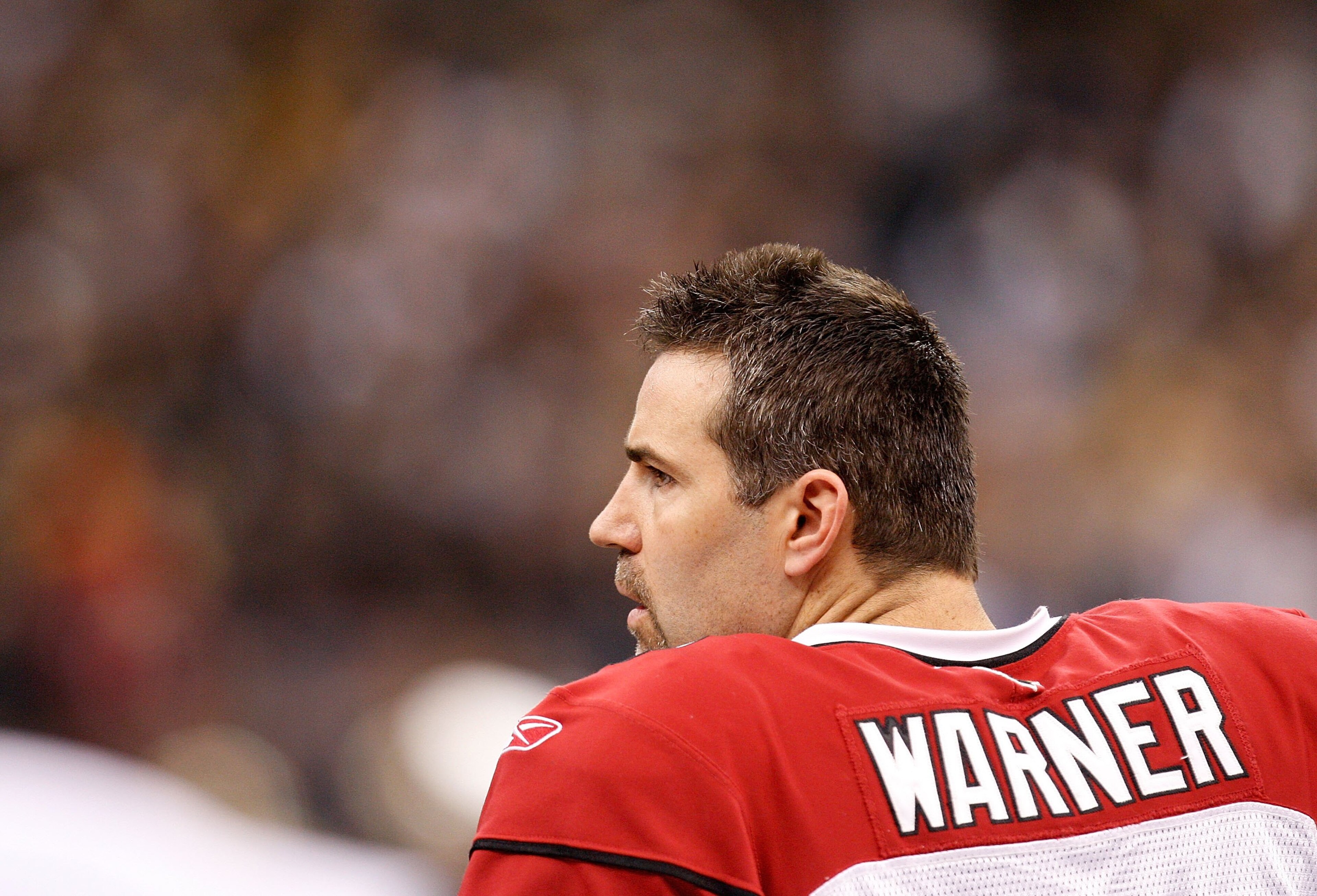 NEW ORLEANS - JANUARY 16:  Quarterback Kurt Warner #13 of the Arizona Cardinals looks on from the sideline against the New Orleans Saints during the NFC Divisional Playoff Game at Louisana Superdome on January 16, 2010 in New Orleans, Louisiana. The Saint
