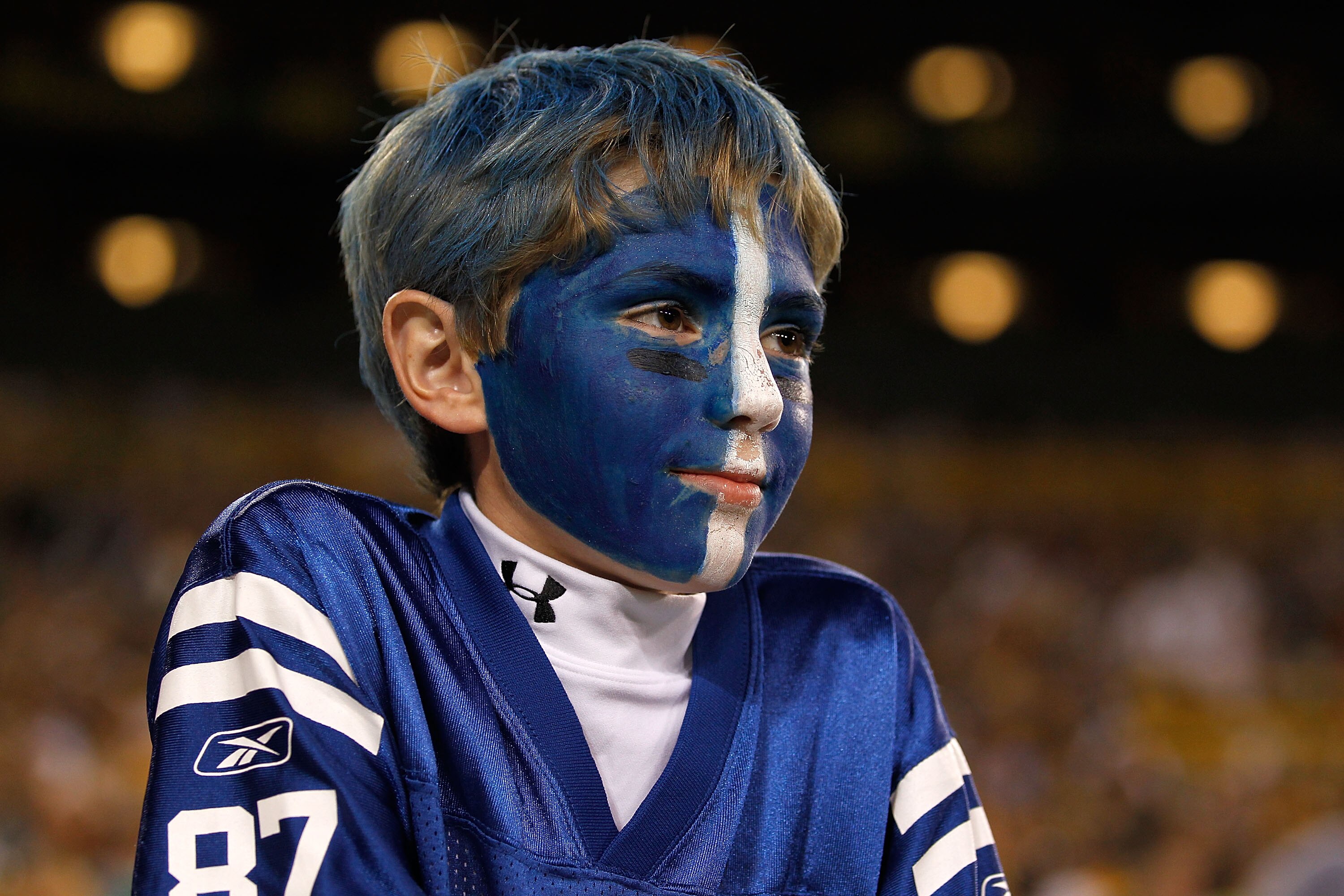 GREEN BAY, WI - AUGUST 26: A young fan of the Indianapolis Colts watches as his team takes on the Green Bay Packers during a preseason game at Lambeau Field on August 26, 2010 in Green Bay, Wisconsin. The Packers defeated the Colts 59-24. (Photo by Jonat GREEN BAY, WI - AUGUST 26: A young fan of the Indianapolis Colts watches as his team takes on the Green Bay Packers during a preseason game at Lambeau Field on August 26, 2010 in Green Bay, Wisconsin. The Packers defeated the Colts 59-24. (Photo by Jonat